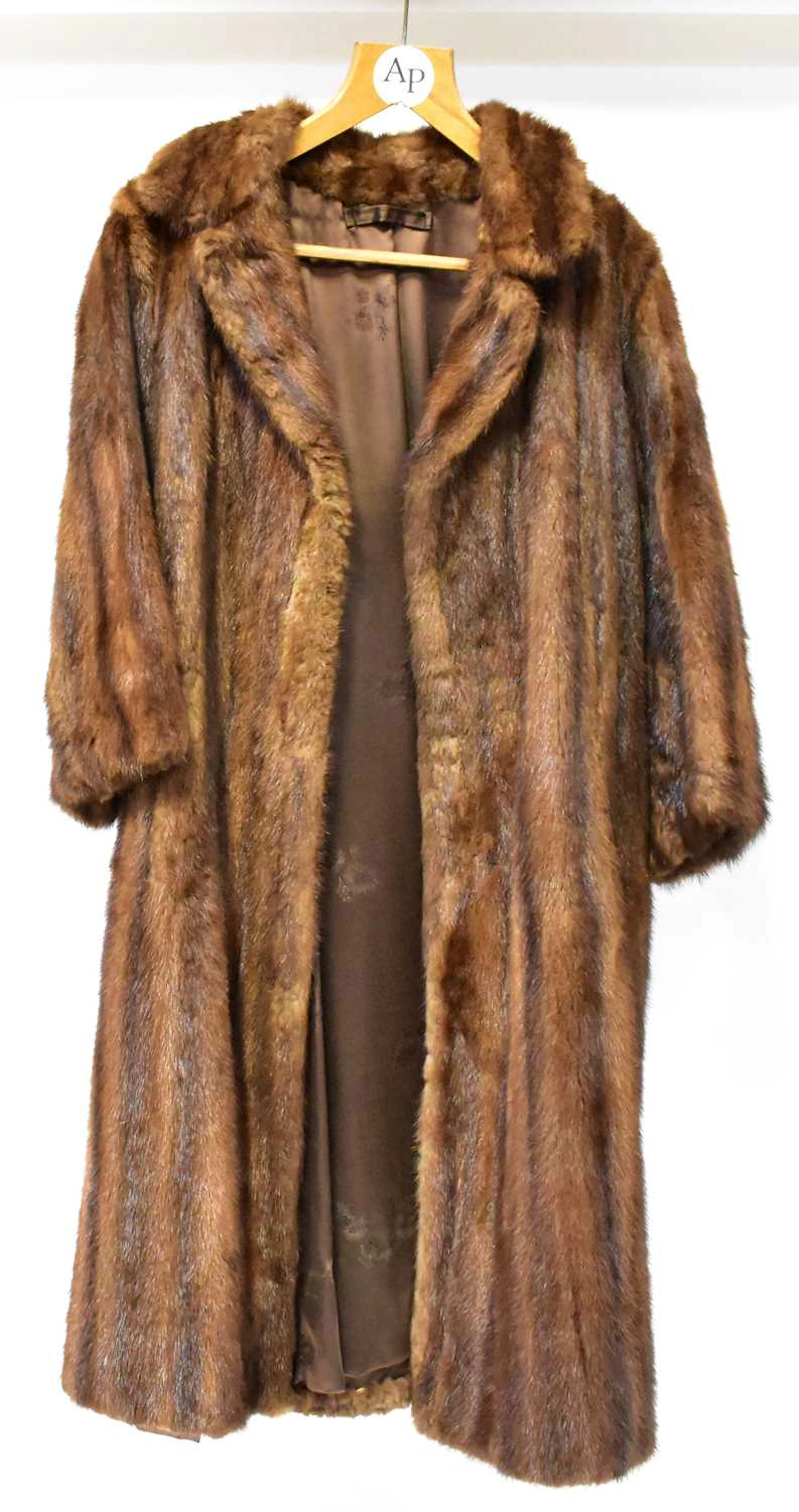 Four fur and faux fur coats comprising two long black faux fur coats