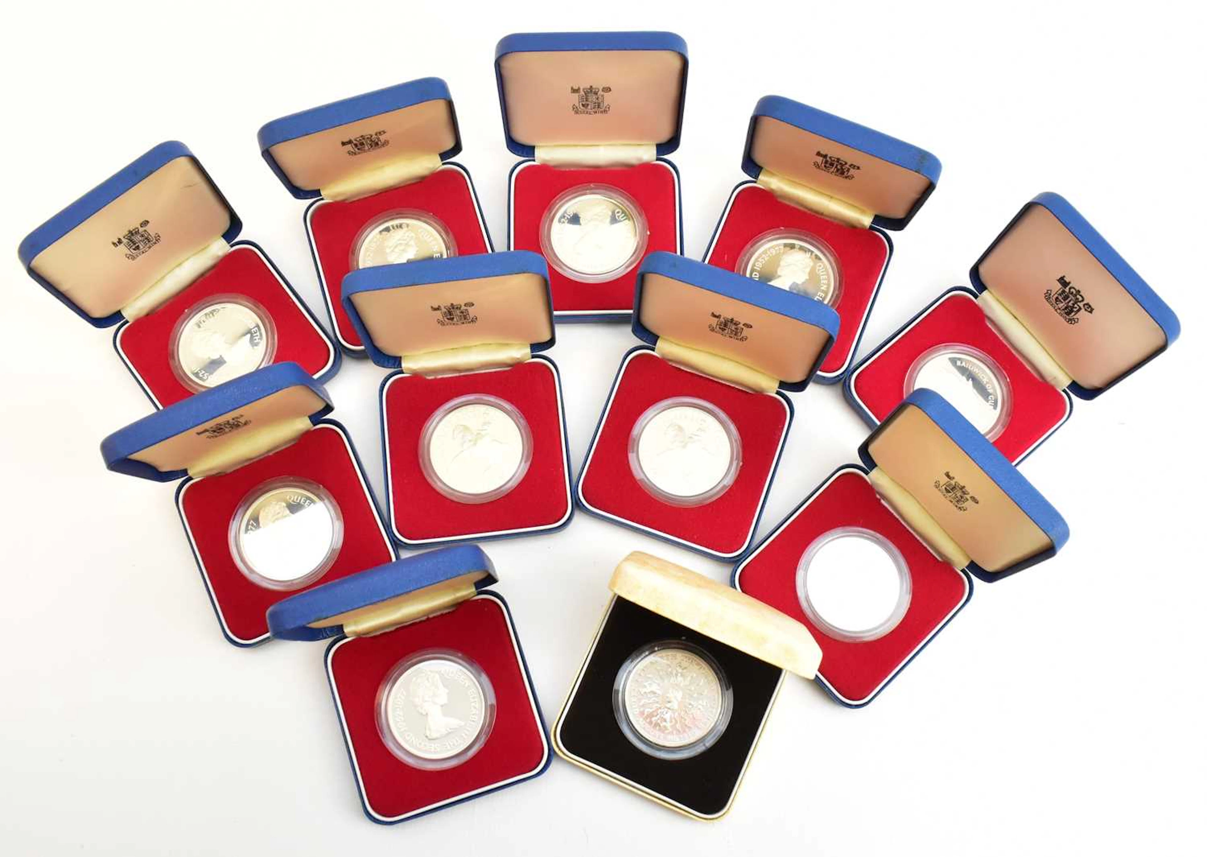 THE ROYAL MINT; eleven boxed silver commemorative coins