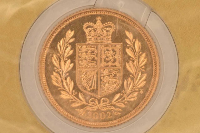 ROYAL MINT; a cased encapsulated 2002 United Kingdom 22ct gold bullion sovereign