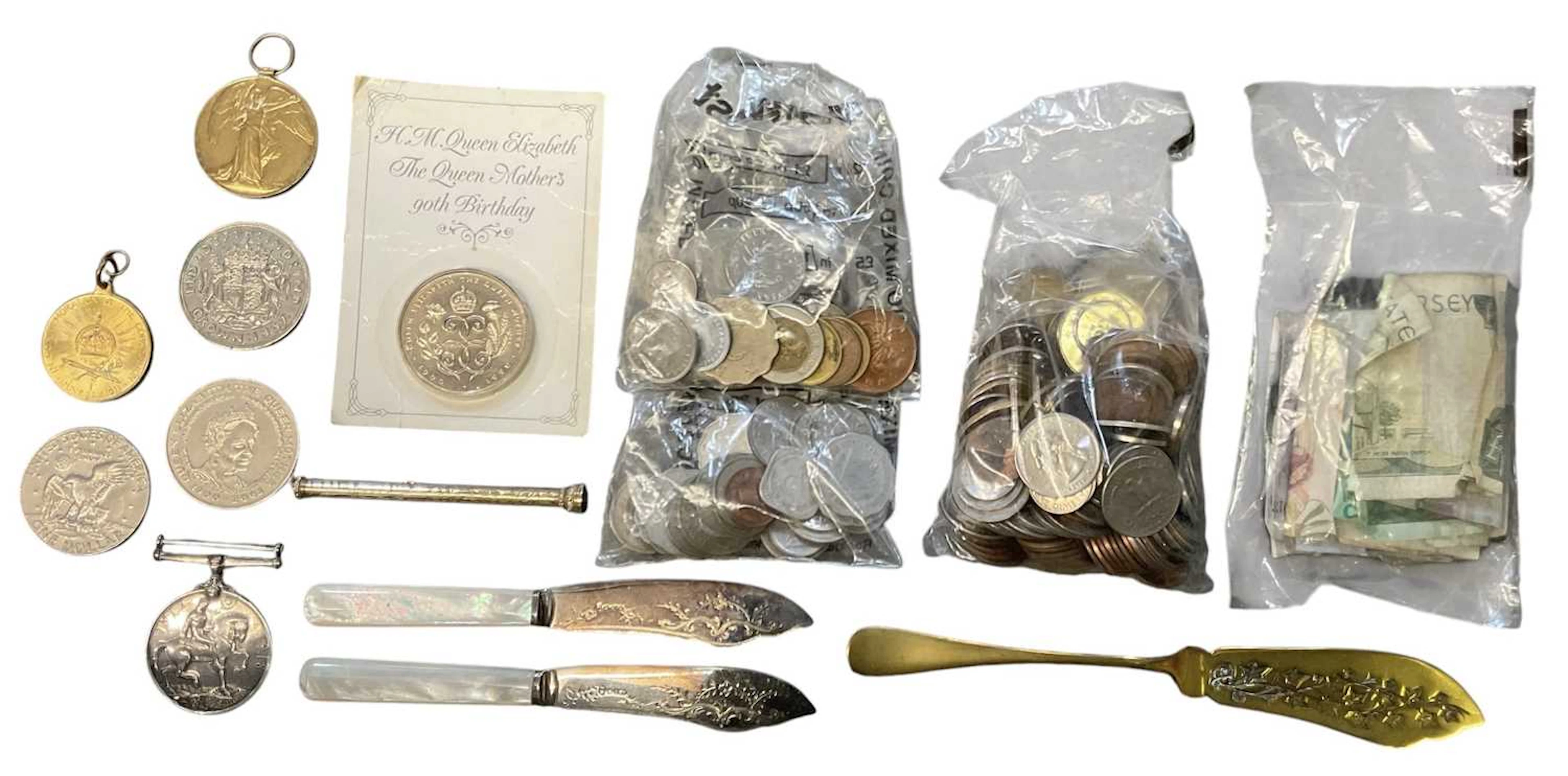 A quantity of assorted all world coins and banknotes