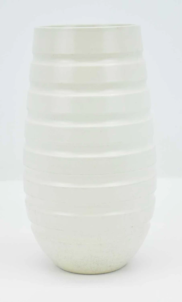 KEITH MURRAY FOR WEDGWOOD; a 1930s Art Deco white tapered...