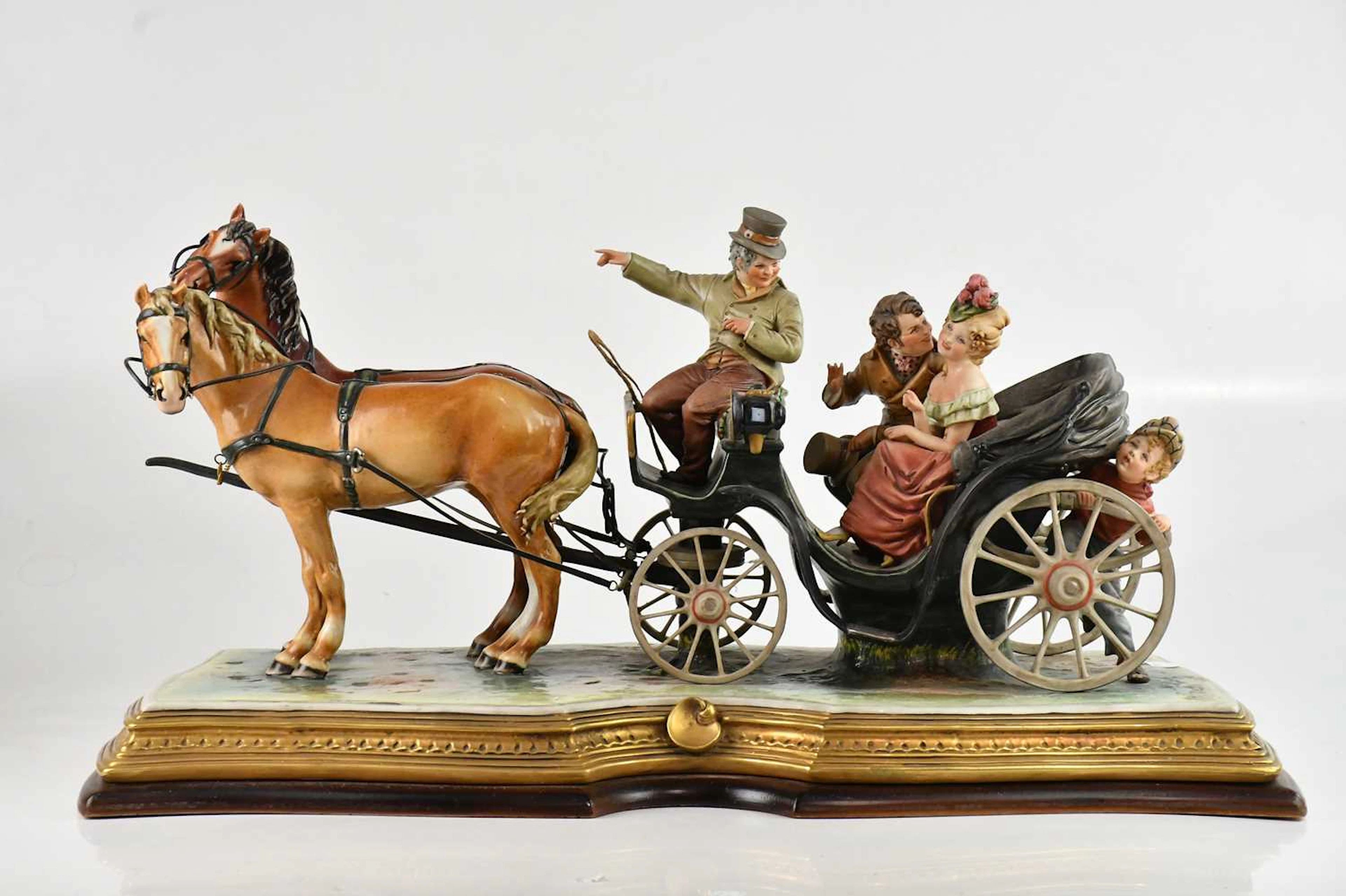 BRUNO MERLI FOR CAPODIMONTE; a ceramic figure of horse drawn carriage