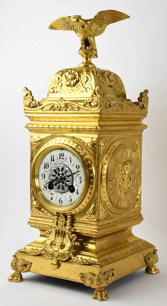 A late 19th/early 20th century French gilt metal ormolu eight day mantel clock