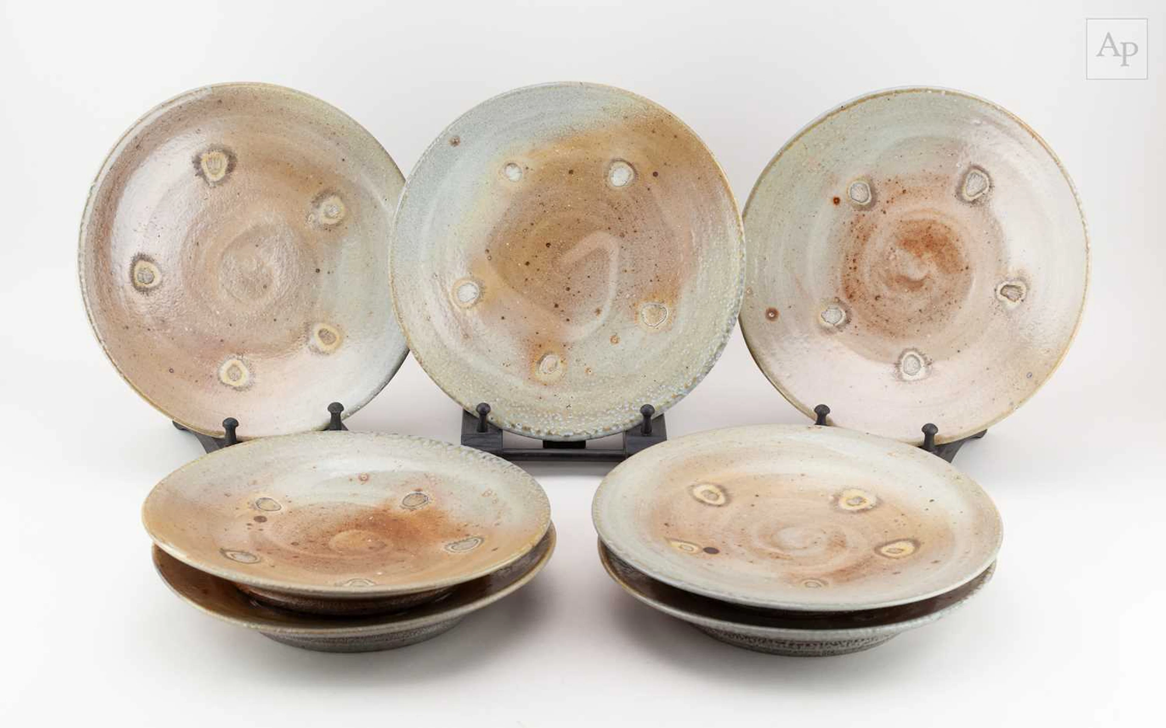 PHIL ROGERS (1951-2020); seven salt glazed dinner plates...