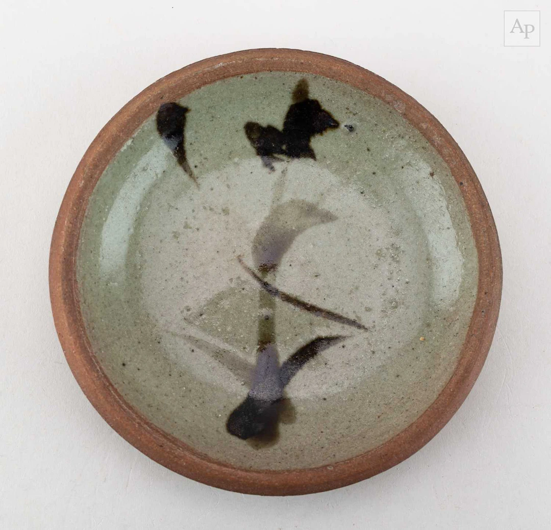 SHOJI HAMADA (1894-1978); a small stoneware dish...