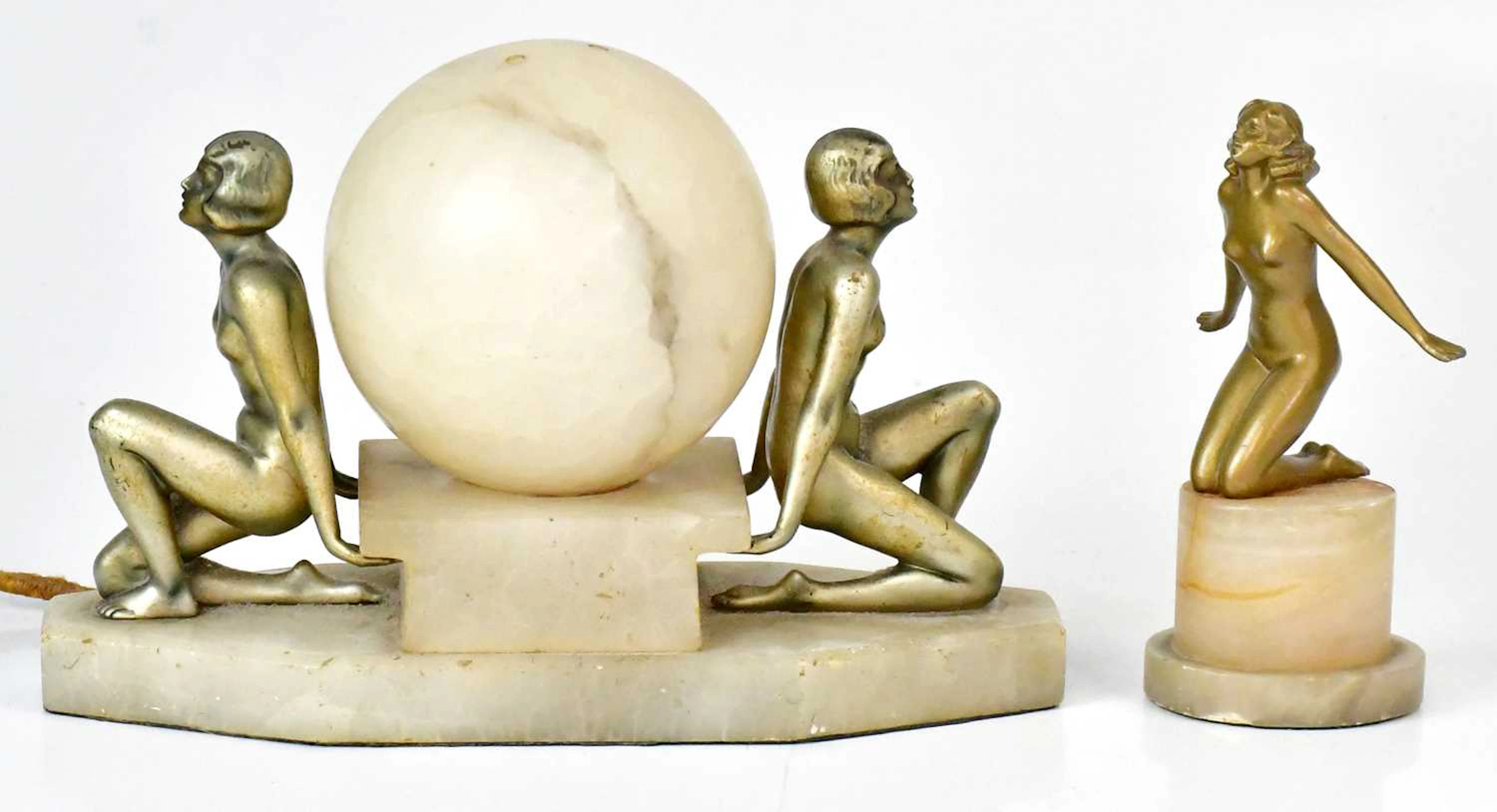 An Art Deco bronzed spelter and alabaster table lamp