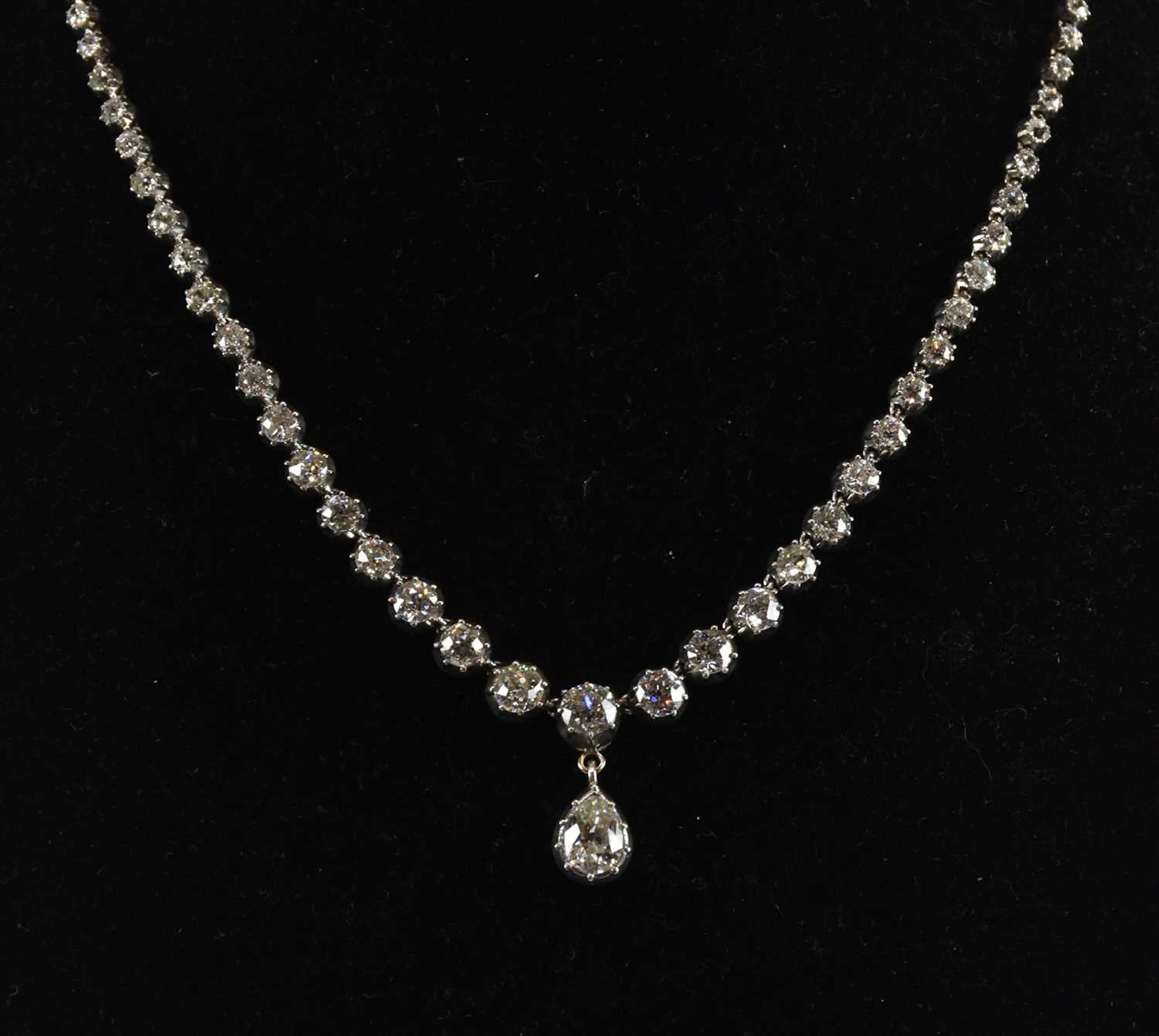 An antique diamond rivière necklace with graduated brilliant cut diamonds