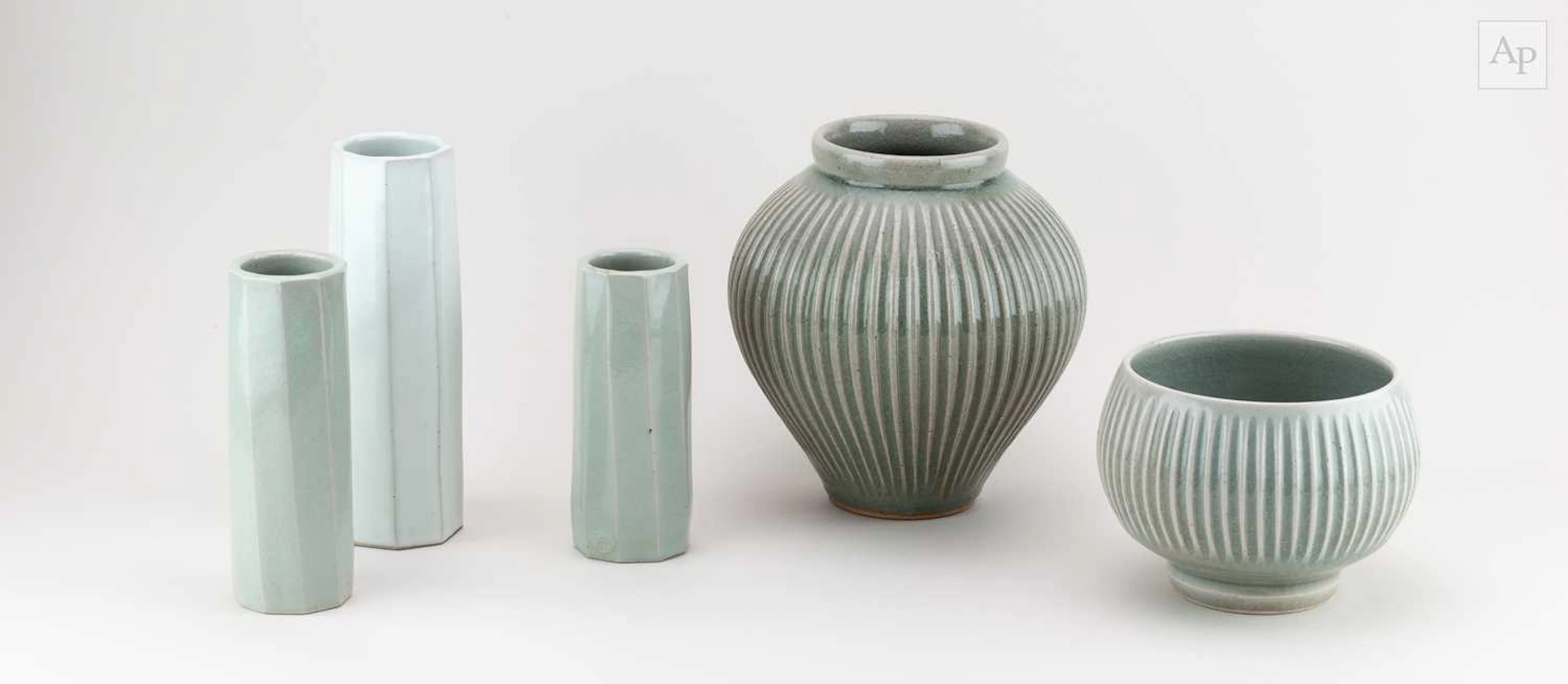 ANDREW CROUCH (born 1955); a fluted stoneware jar covered in green ash glaze