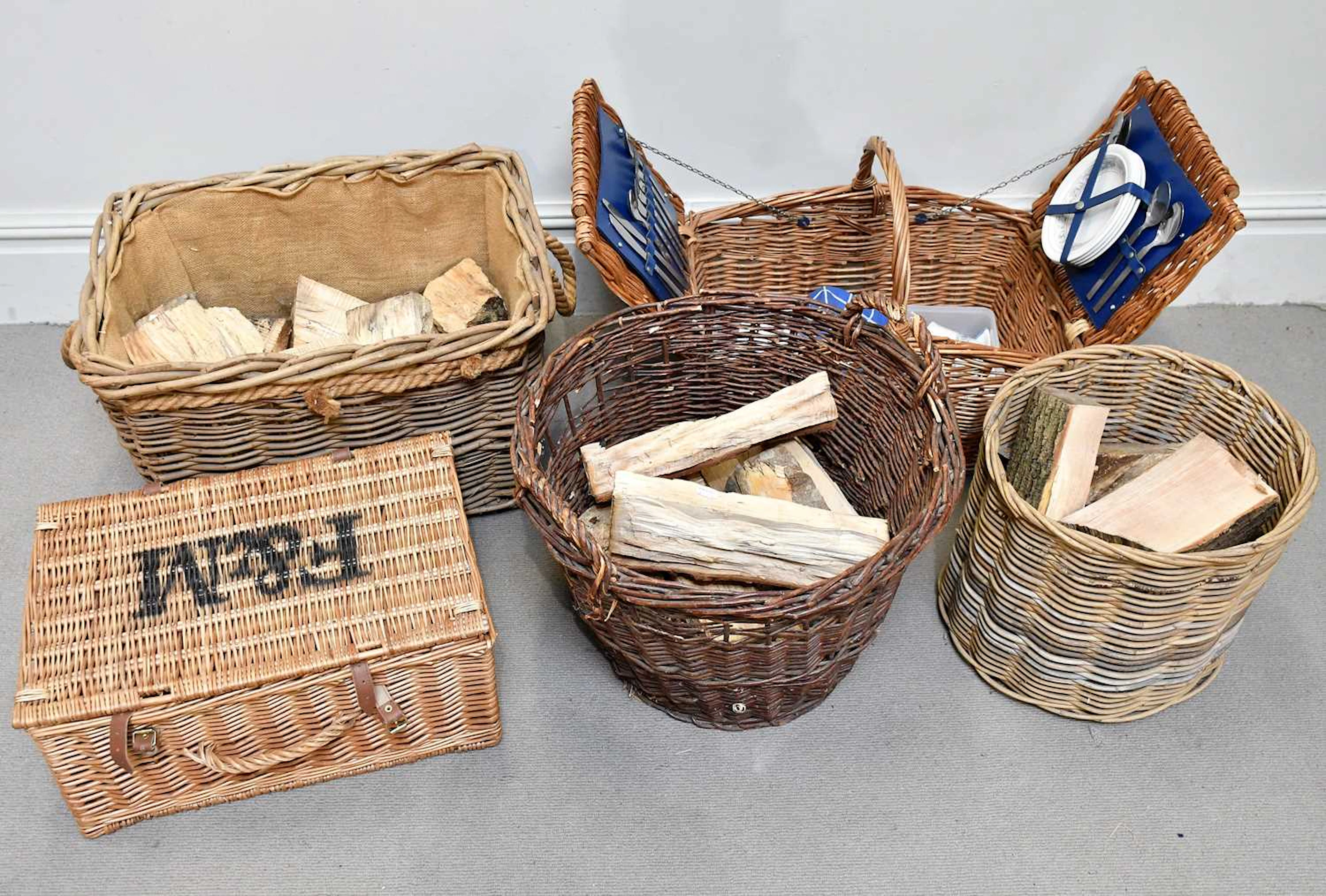 Three log baskets with logs
