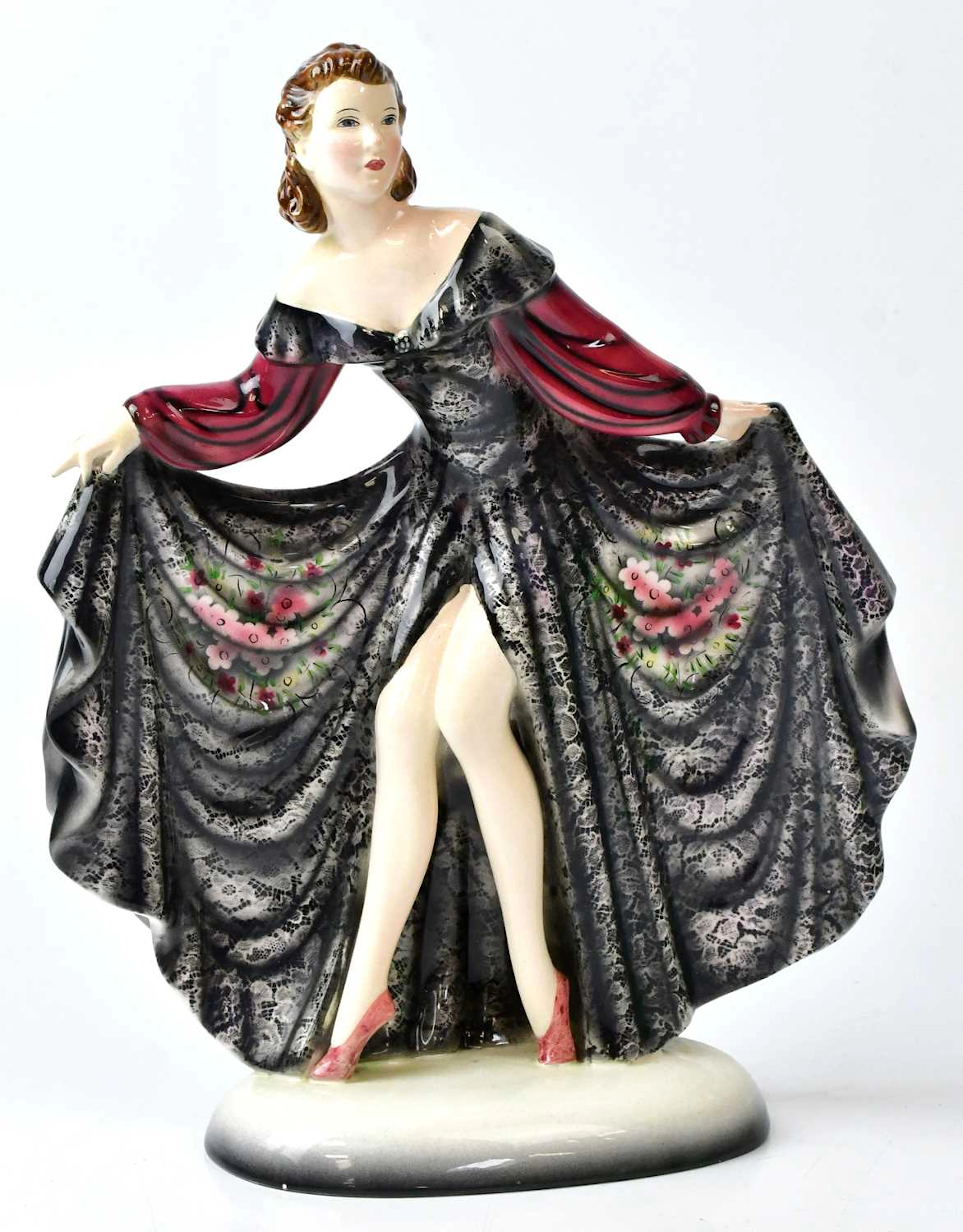 GOLDSCHEIDER; a porcelain figure of a young woman wearing...