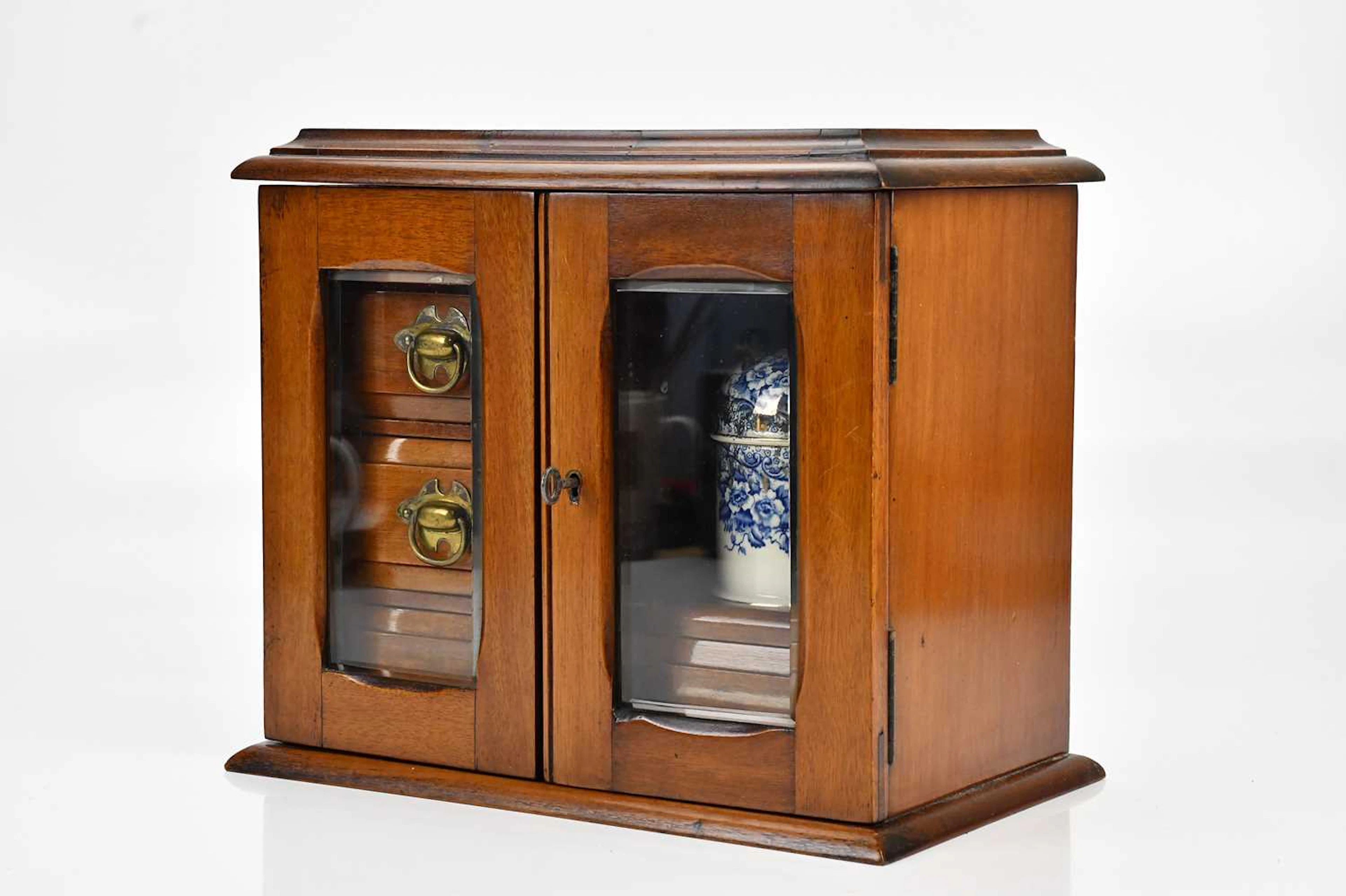 A late Victorian mahogany smoker's cabinet containing...