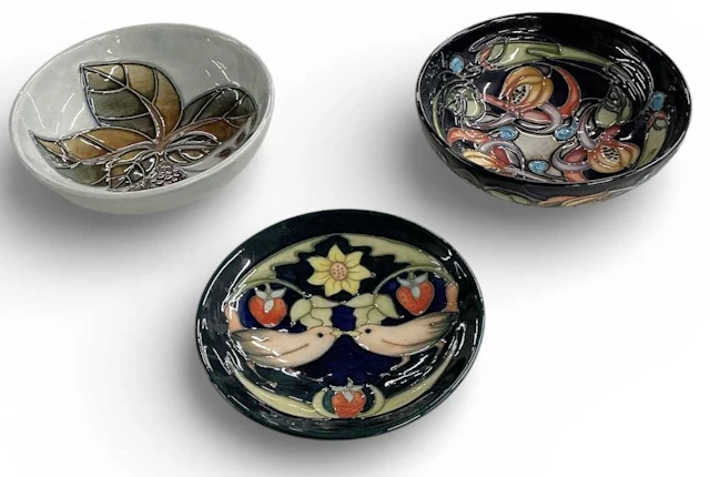 MOORCROFT; an art pottery 'Strawberry Thief' pattern circular pin dish