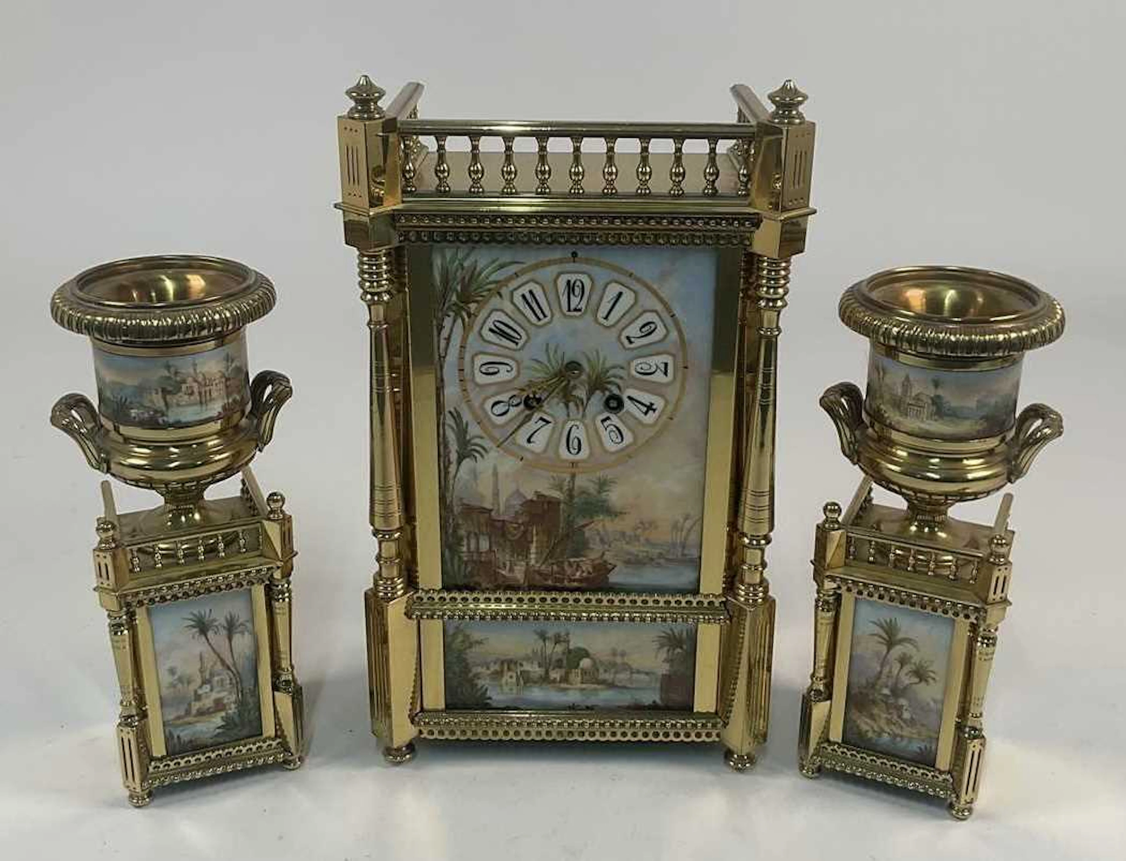 A French brass mantel clock with a Roman numeral dial set...