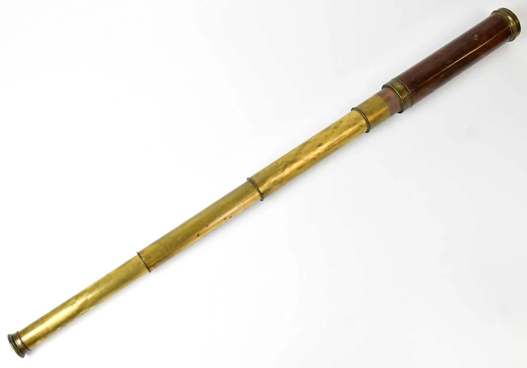 A brass and wooden cased four draw telescope