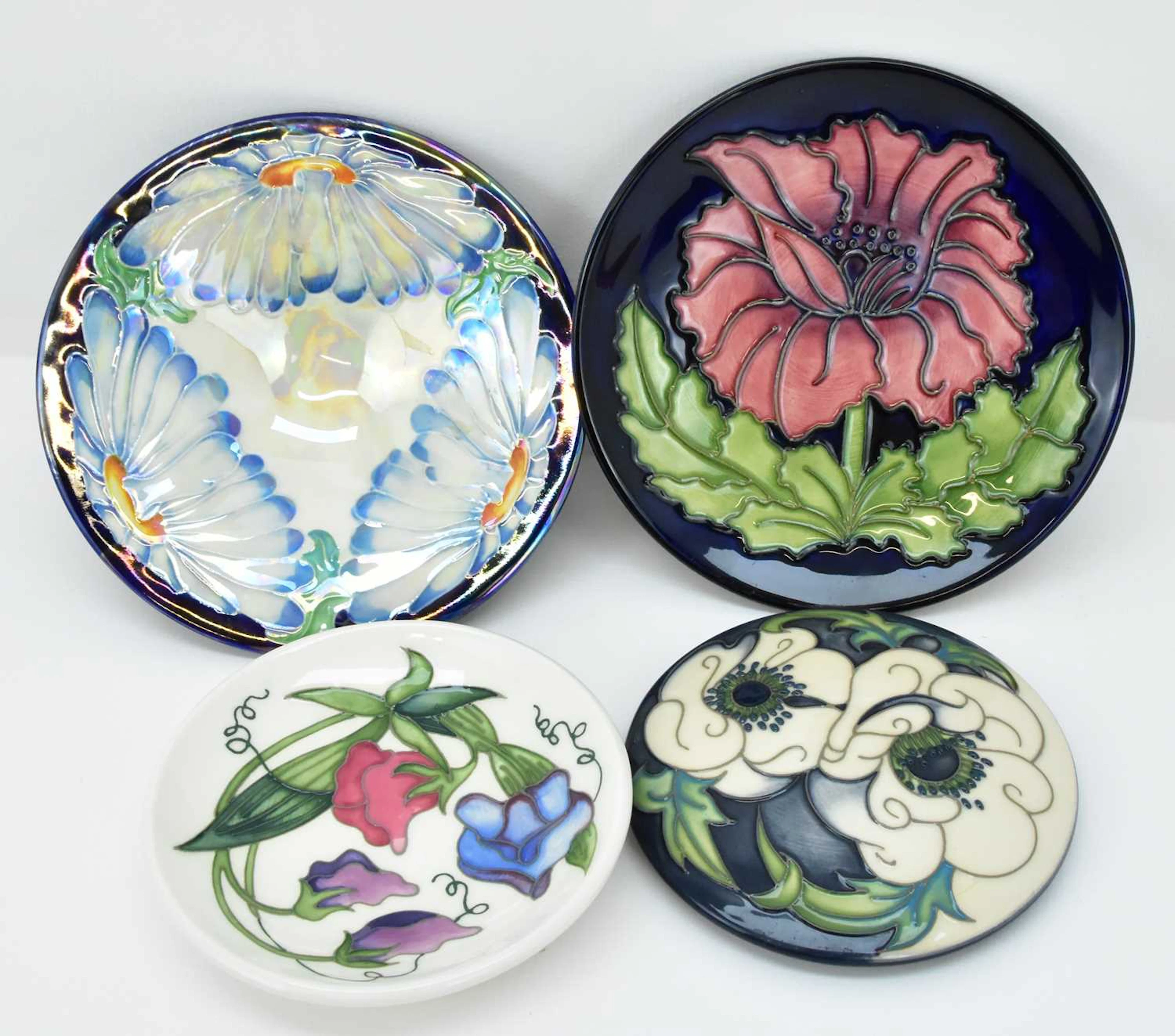 MOORCROFT; three items of pottery comprising a...