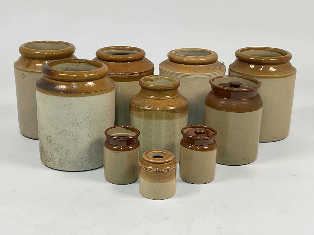 A quantity of stoneware storage jars