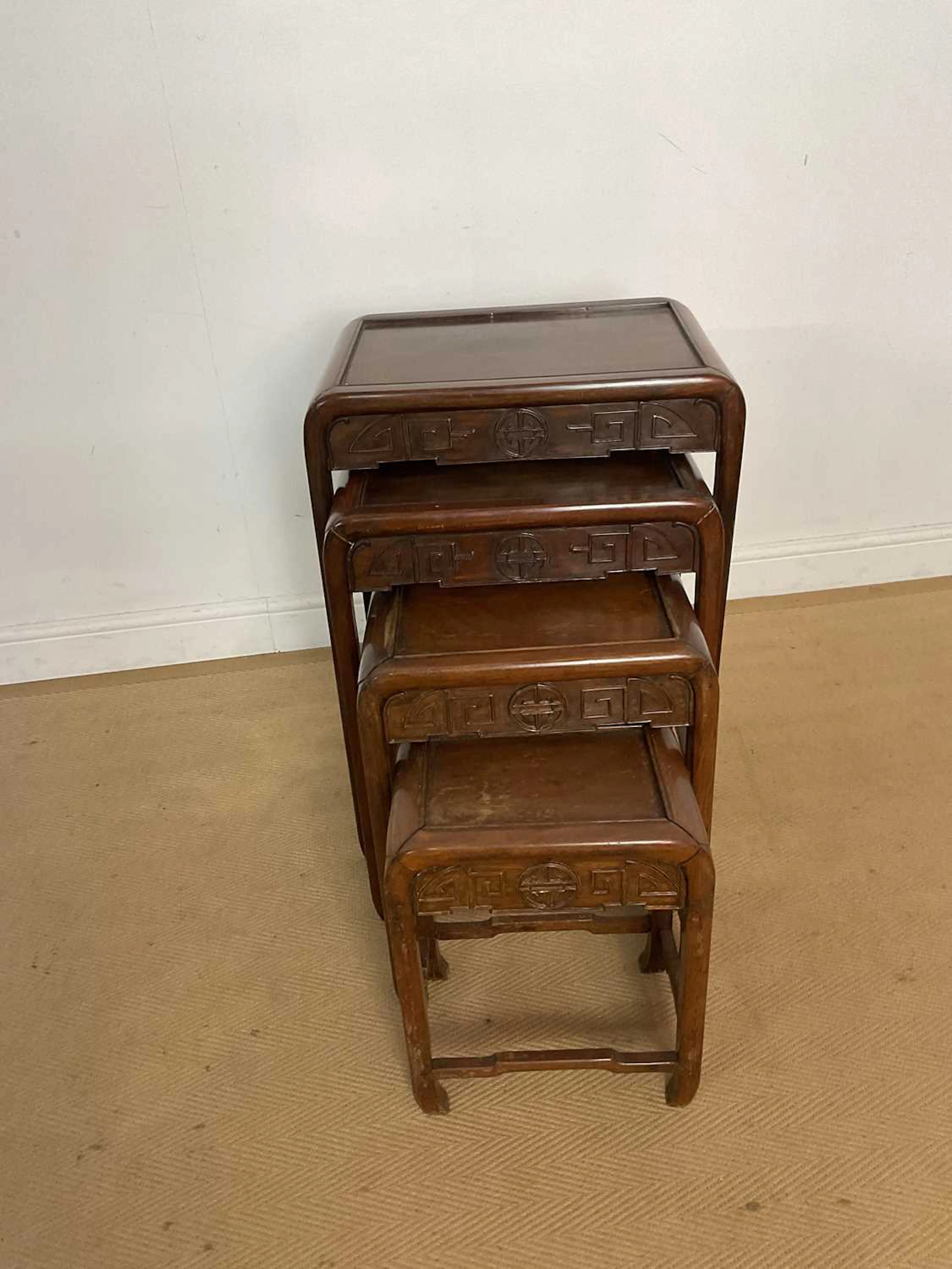 SHUI HING; a nest of four Chinese hardwood tables