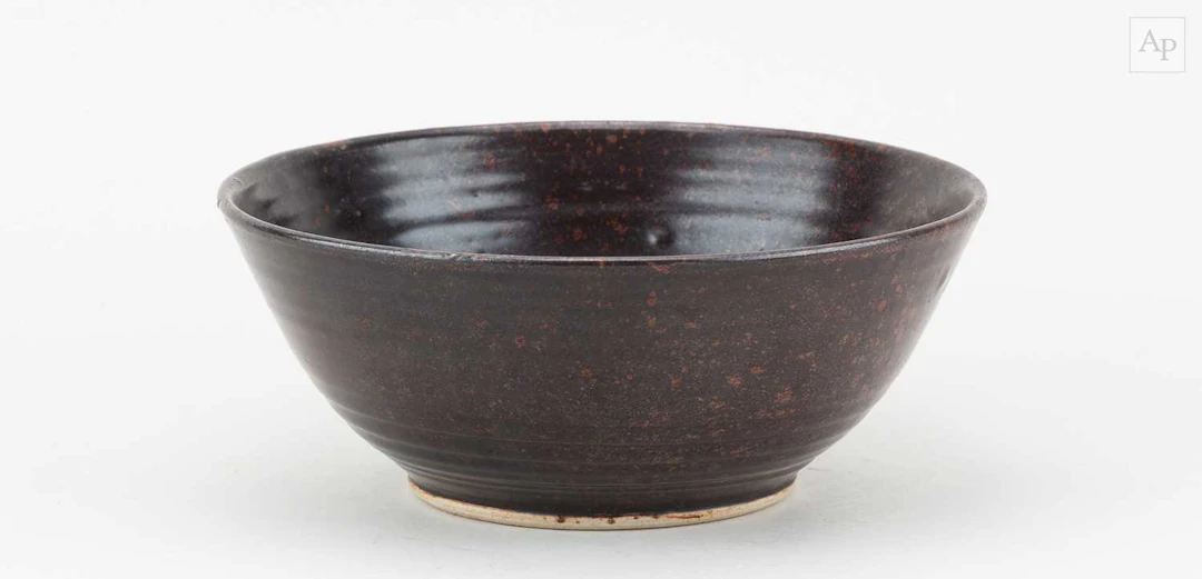 DAN ARBEID (1928-2010); a small stoneware bowl covered in...
