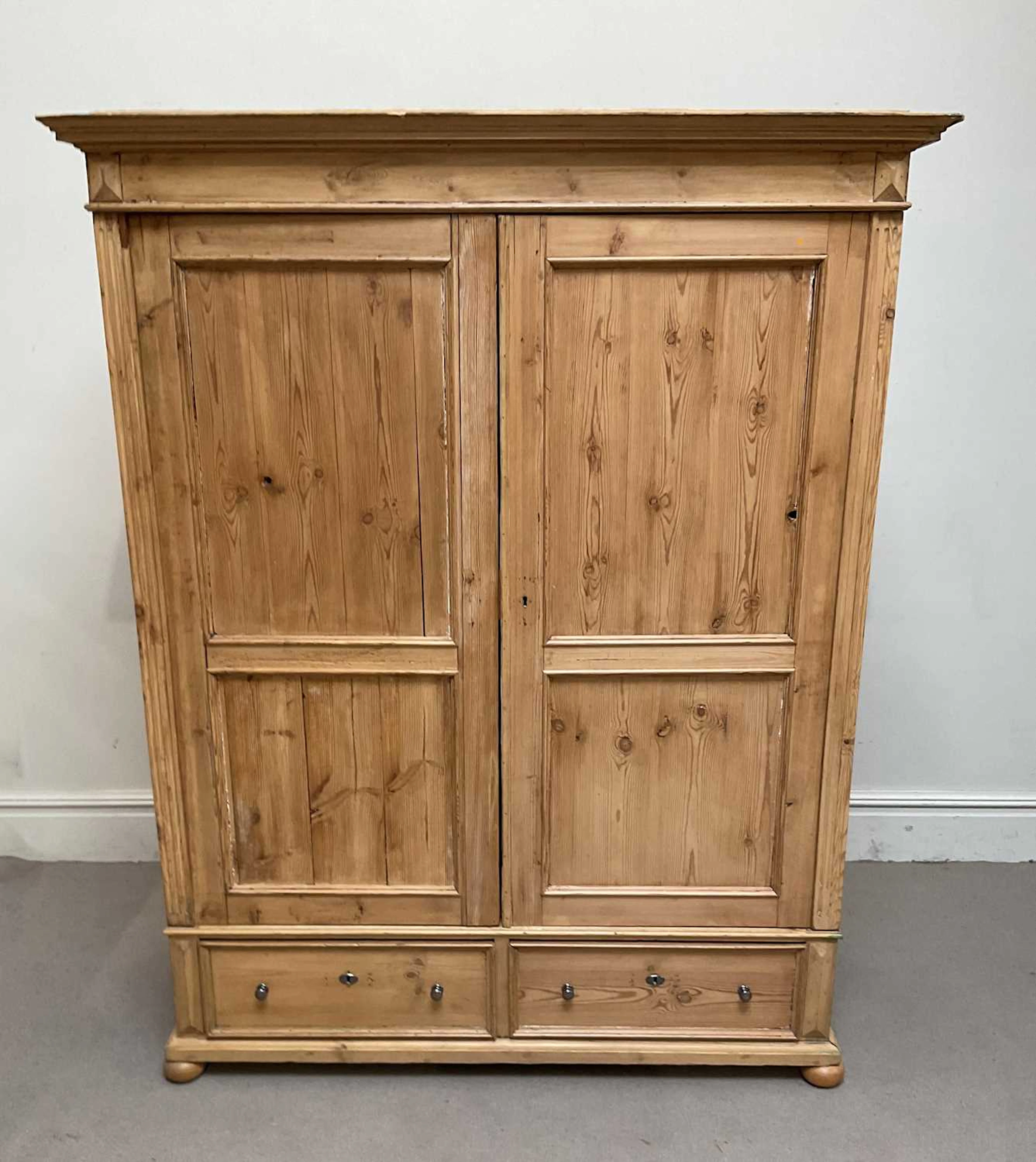 A Continental pine wardrobe