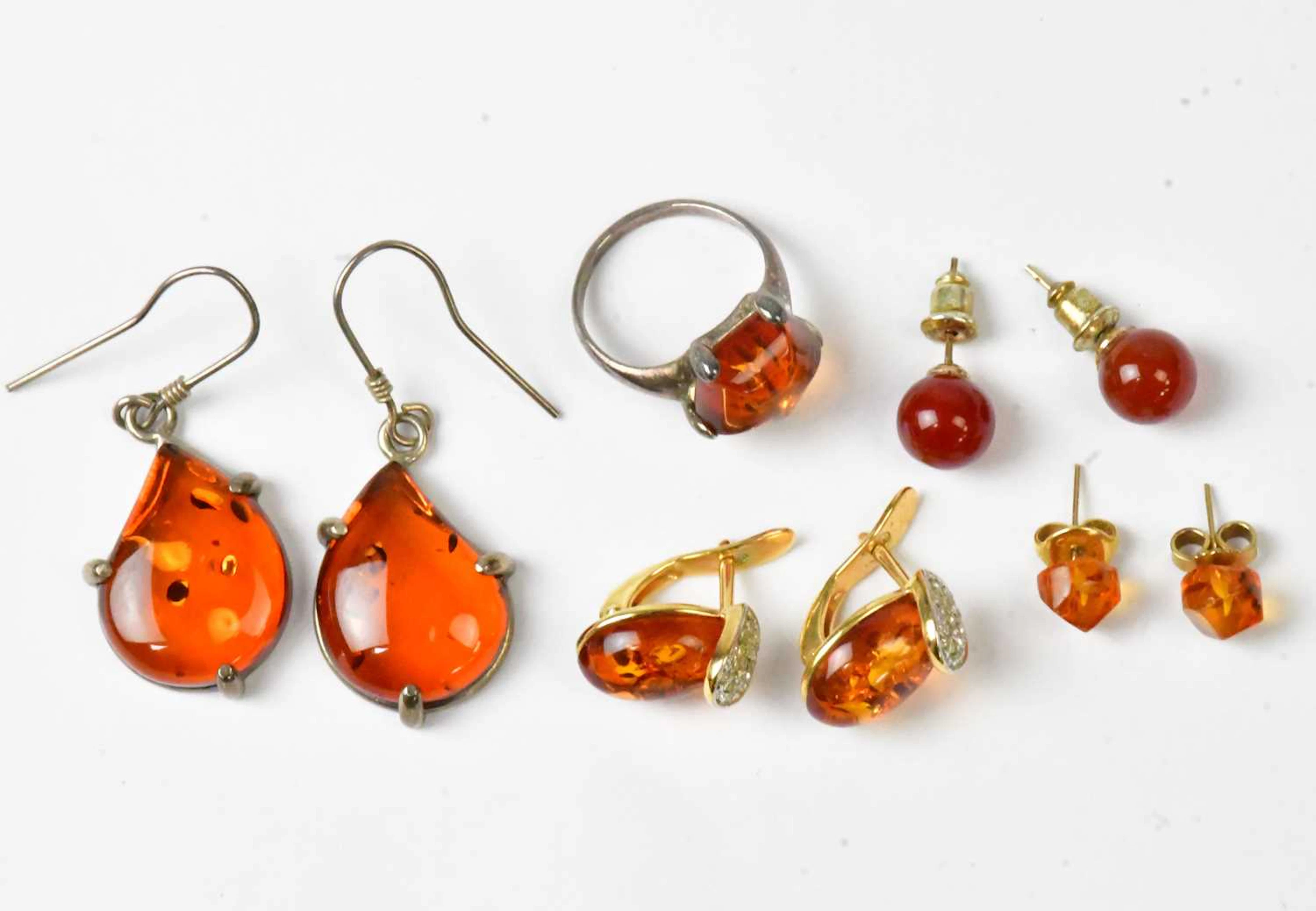 A group of amber-style earrings