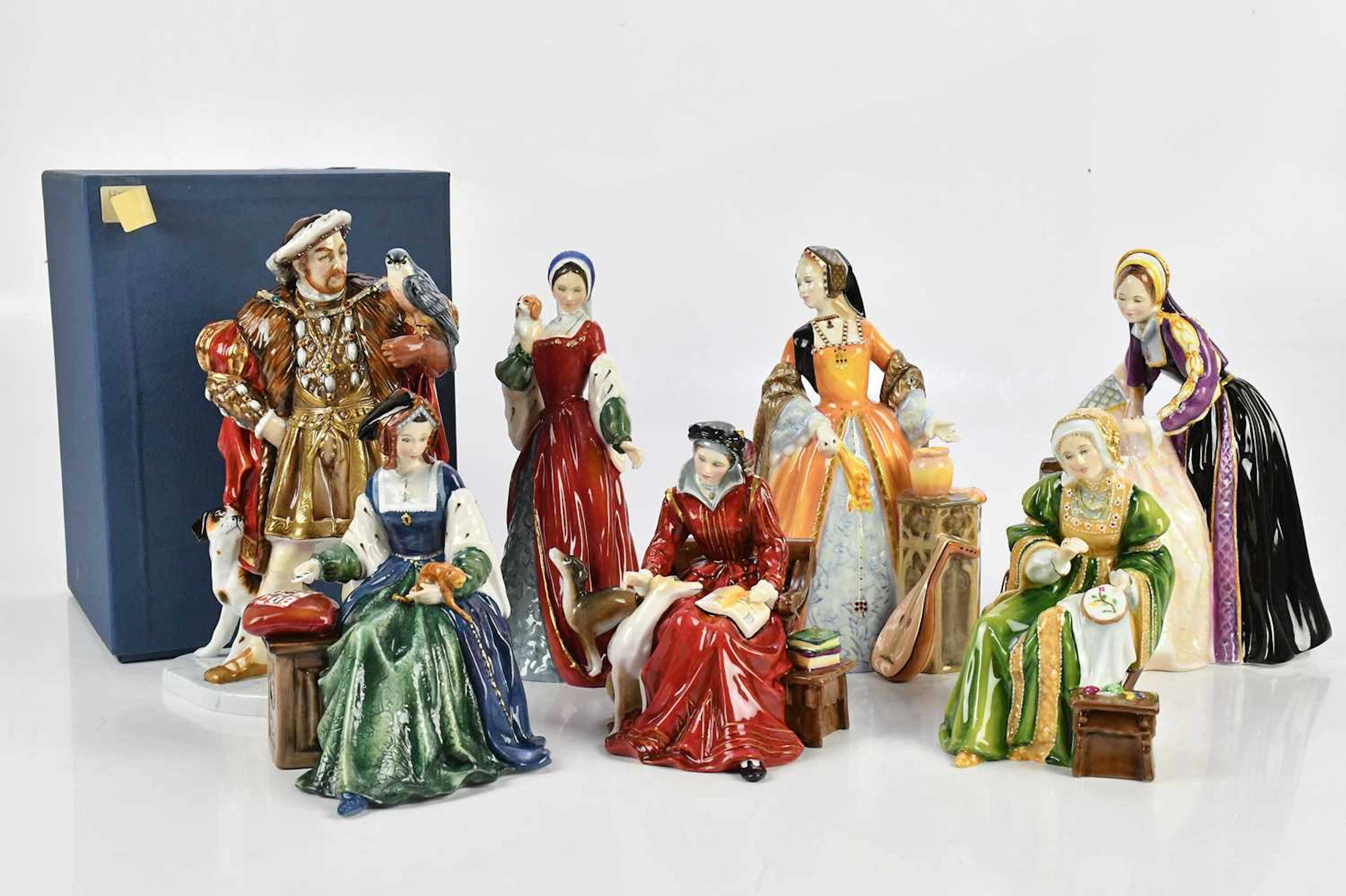 ROYAL DOULTON; a collection of seven figures comprising 'Henry VIII'