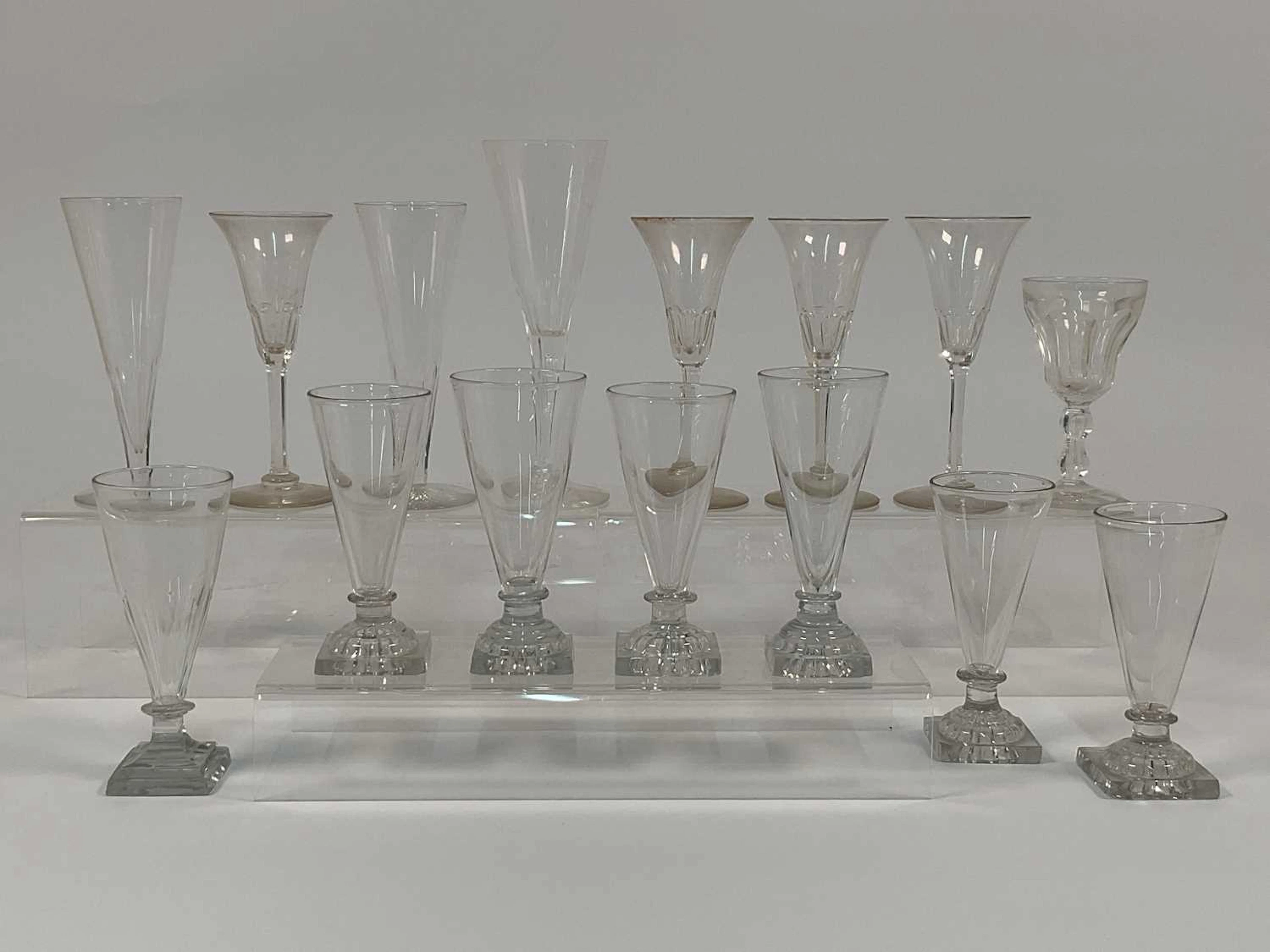 A quantity of Georgian square base dwarf ale glasses
