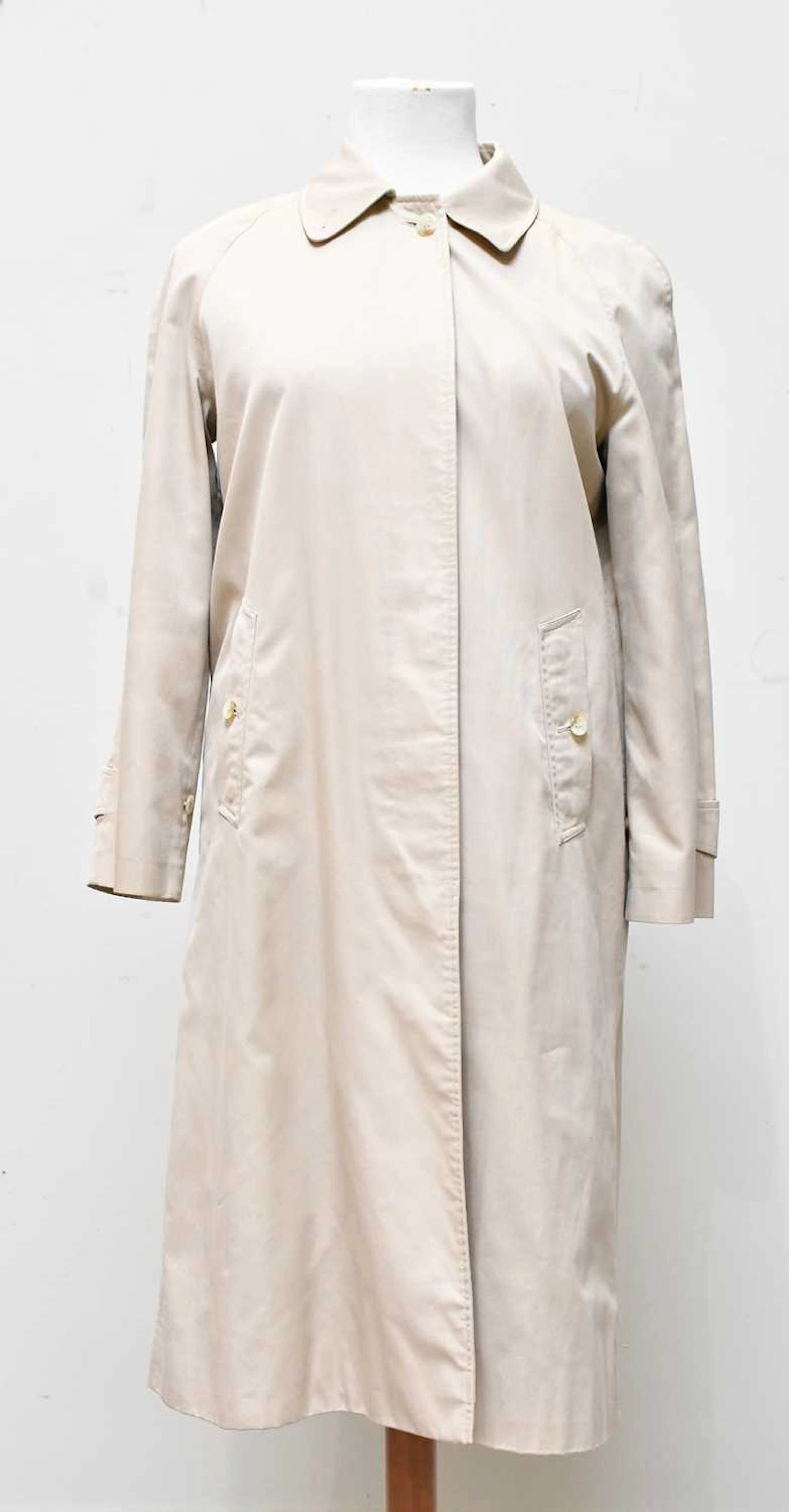 BURBERRY; a lady's beige cotton single breasted trench coat with front buttons