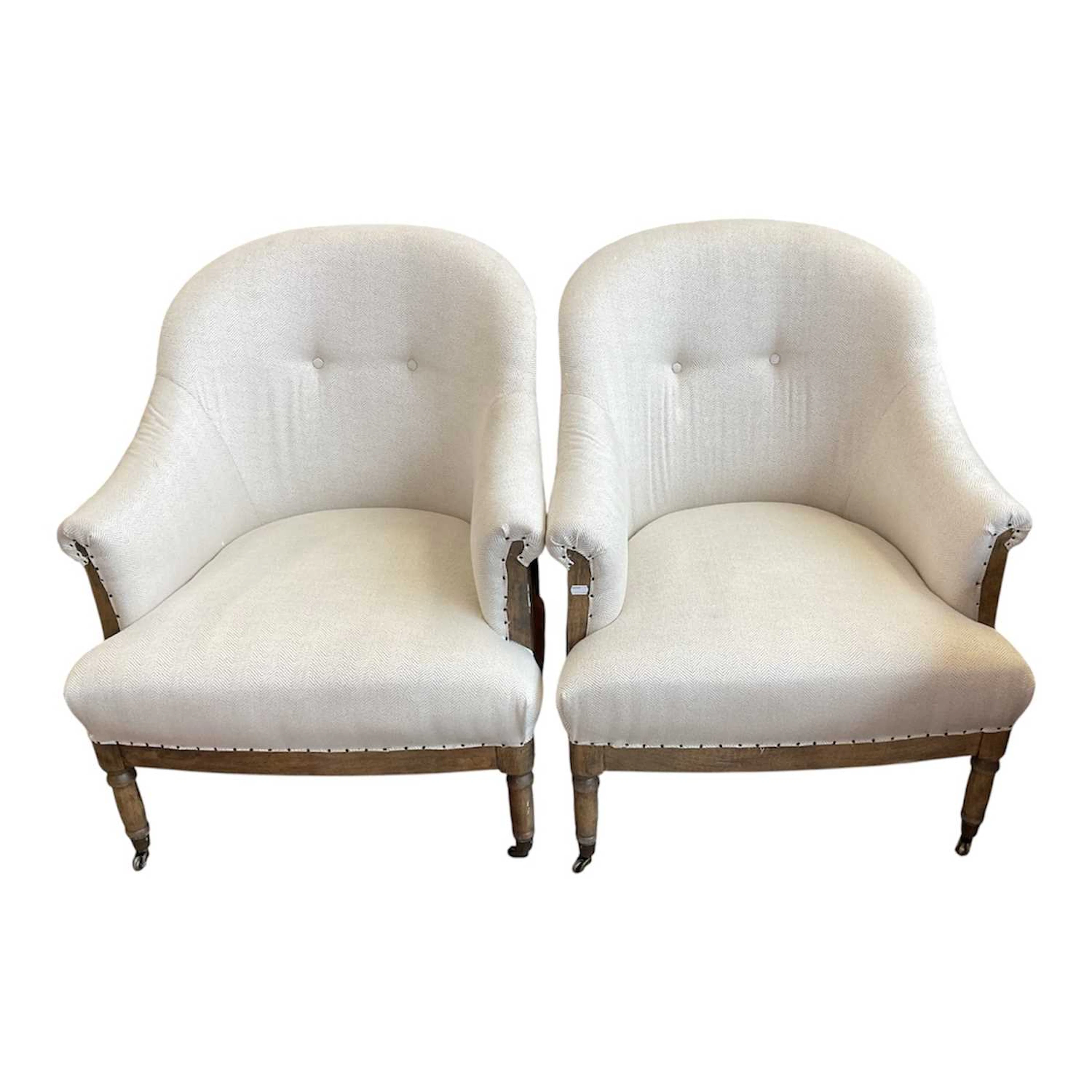 A pair of good quality modern tub chairs