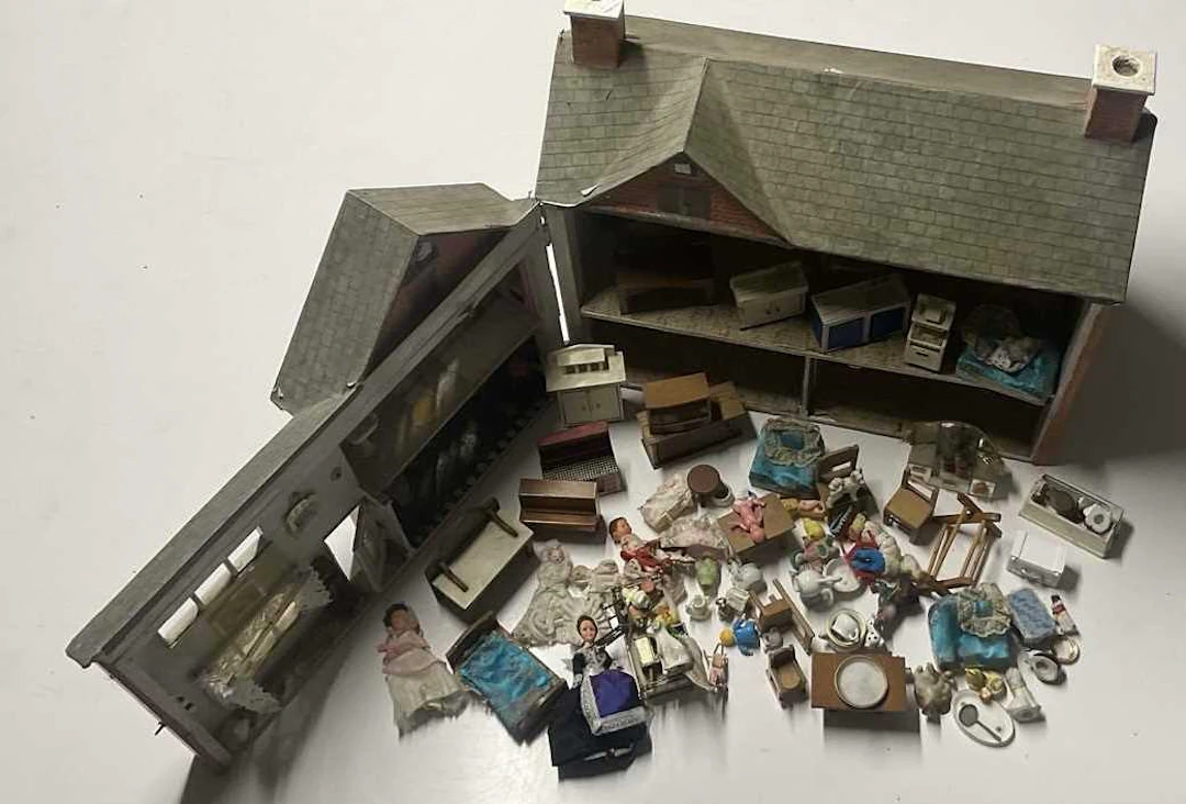 A bespoke made wooden doll's house and quantity of...