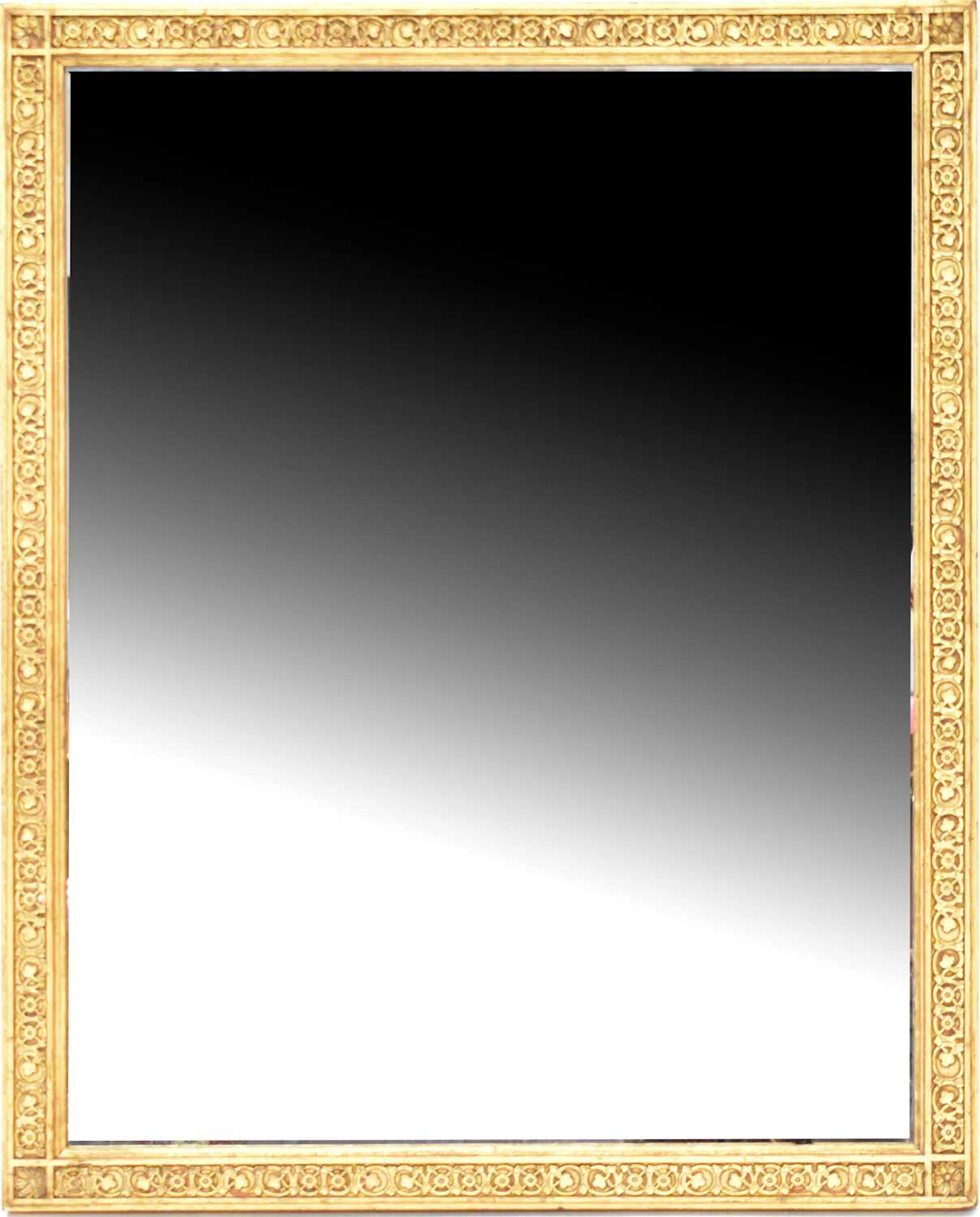 A gilt carved rectangular wall mirror with stop fretwork detail to the frame