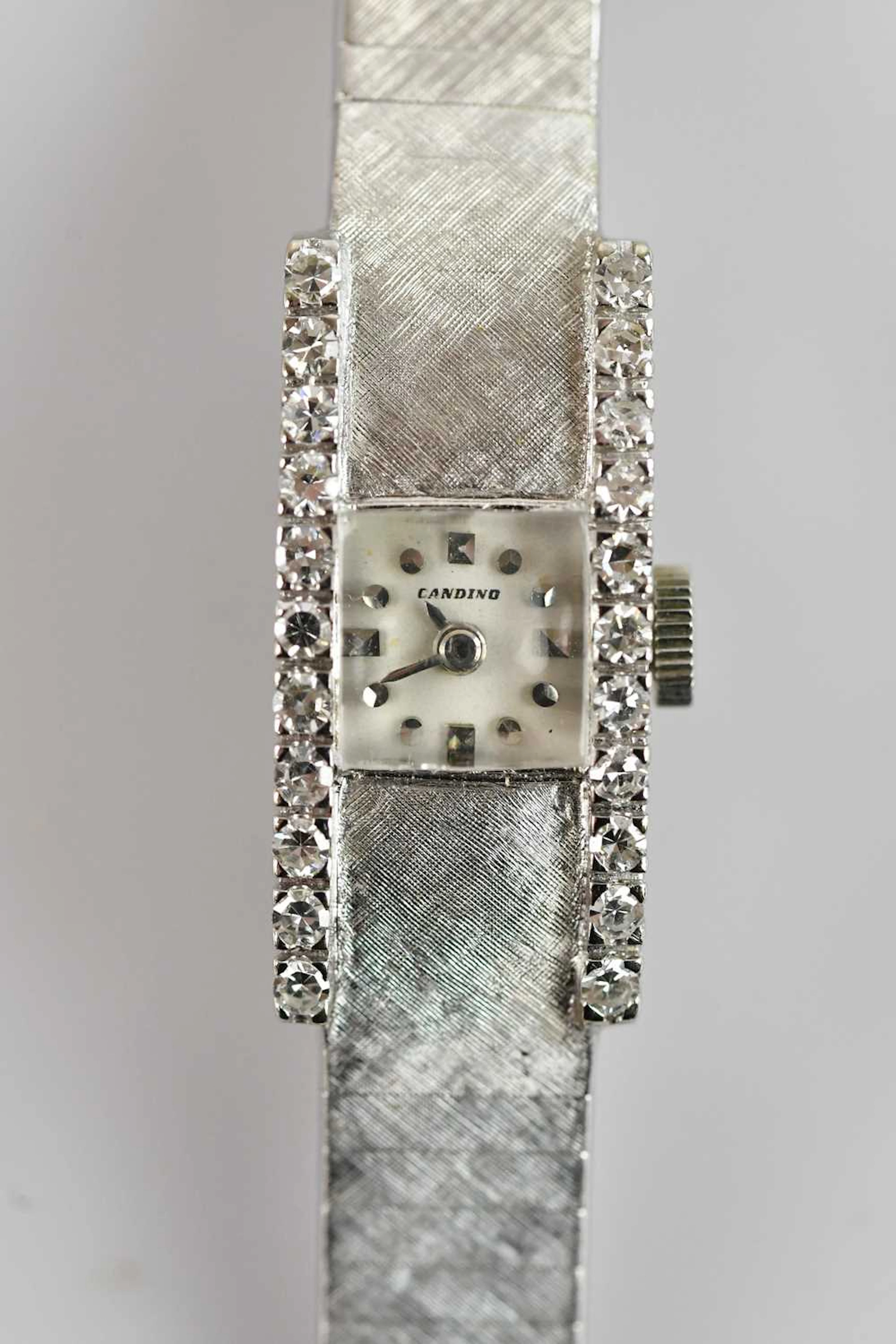 CANDINO; a lady's white textured metal cocktail watch