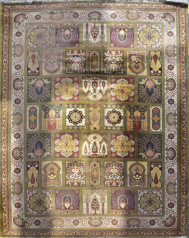 A Persian Bakhtiari style carpet/rug in the garden panel design in green