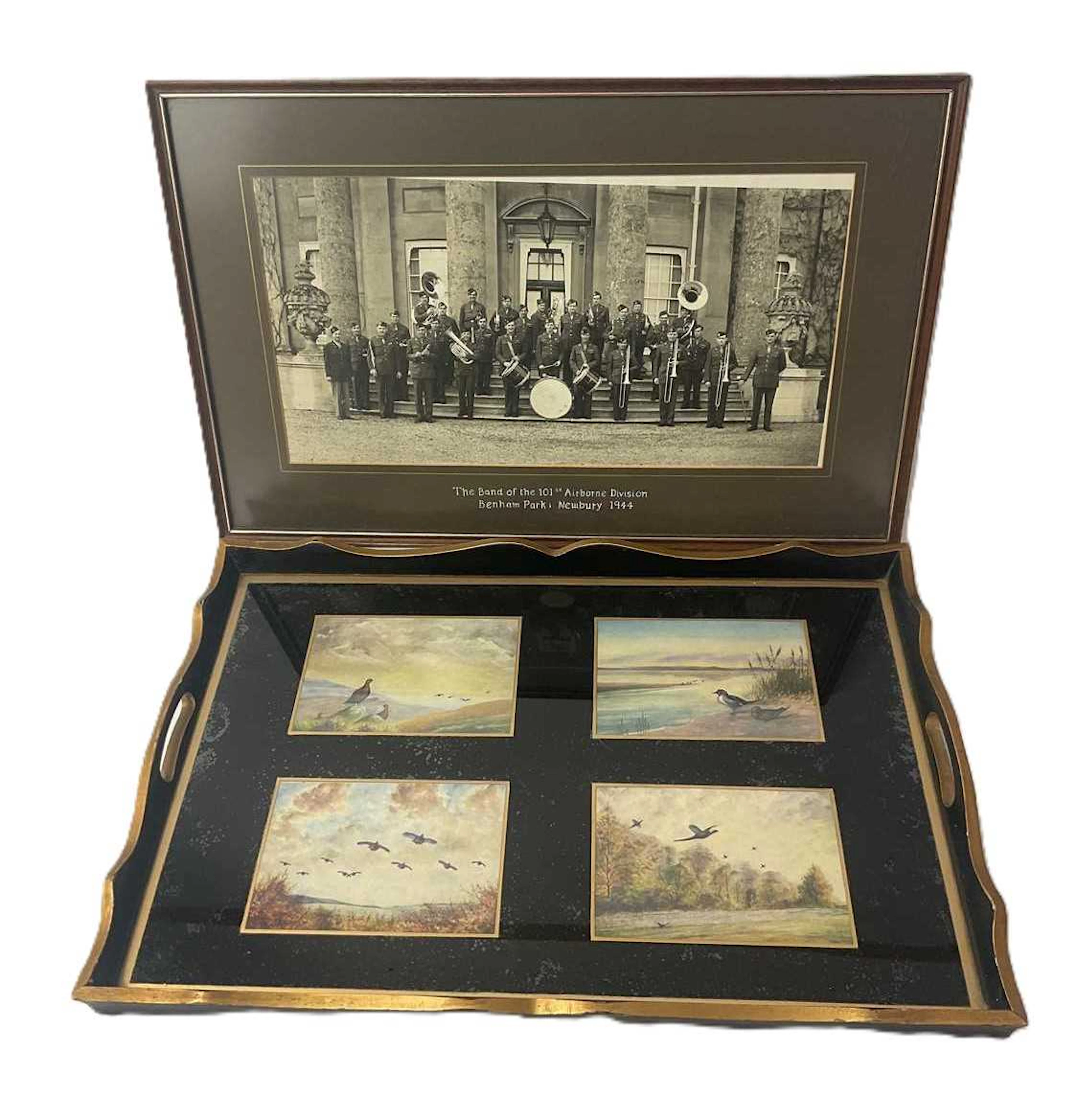 A tray with four printed images of wildfowl