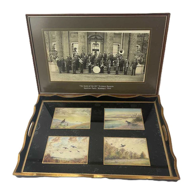 A tray with four printed images of wildfowl