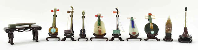A cased collection of ten Chinese carved hardstone...