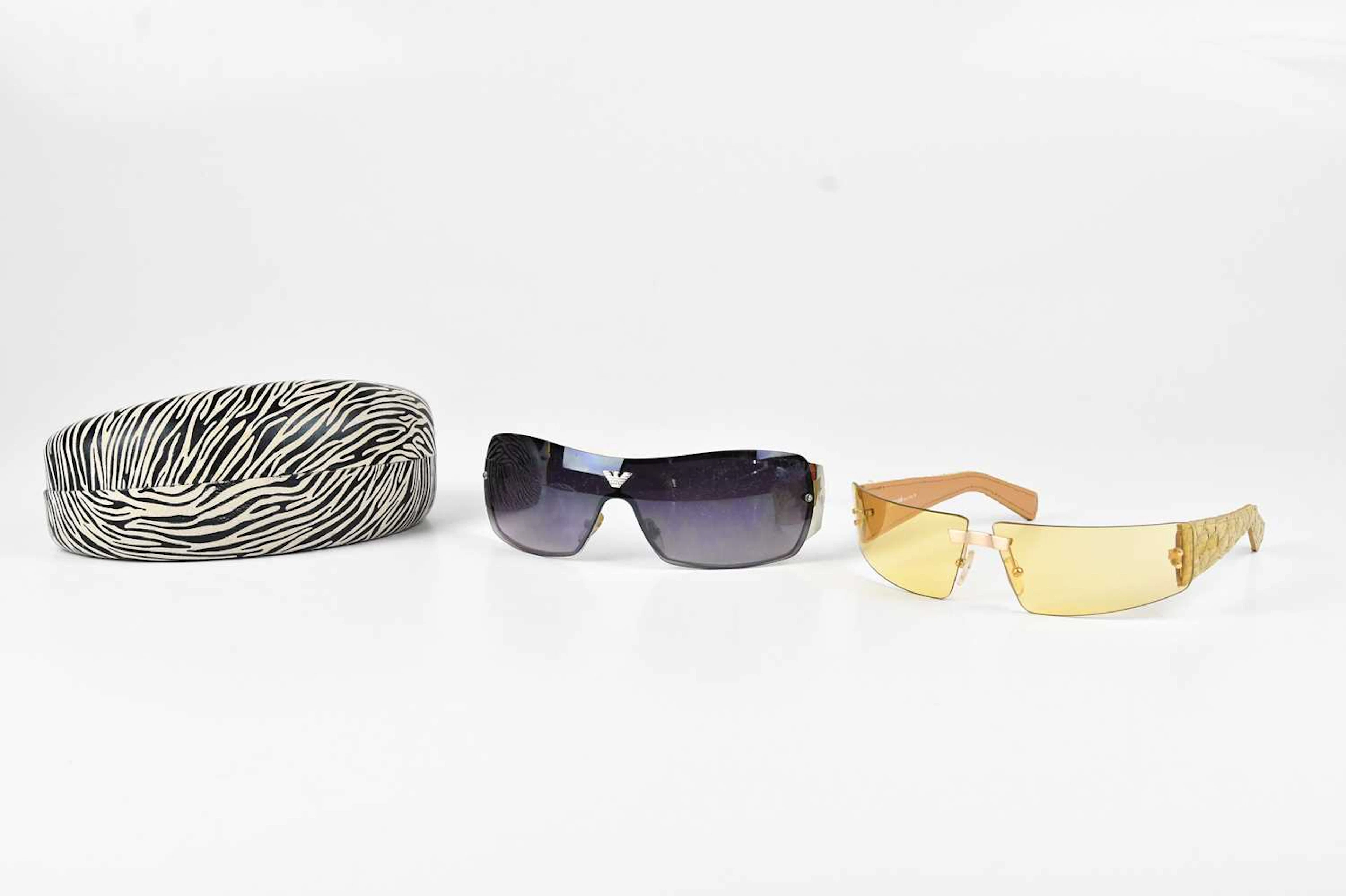 GIORGIO ARMANI; a pair of rimless shield sunglasses