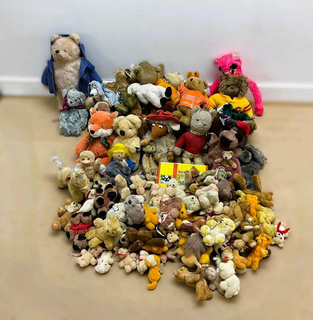 A large quantity of vintage and modern teddy bears and soft toys
