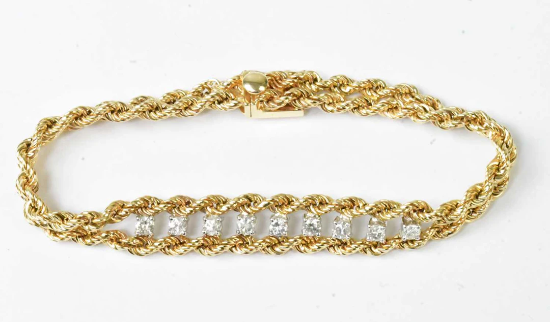 A 14ct yellow gold double rope twist bracelet set with...