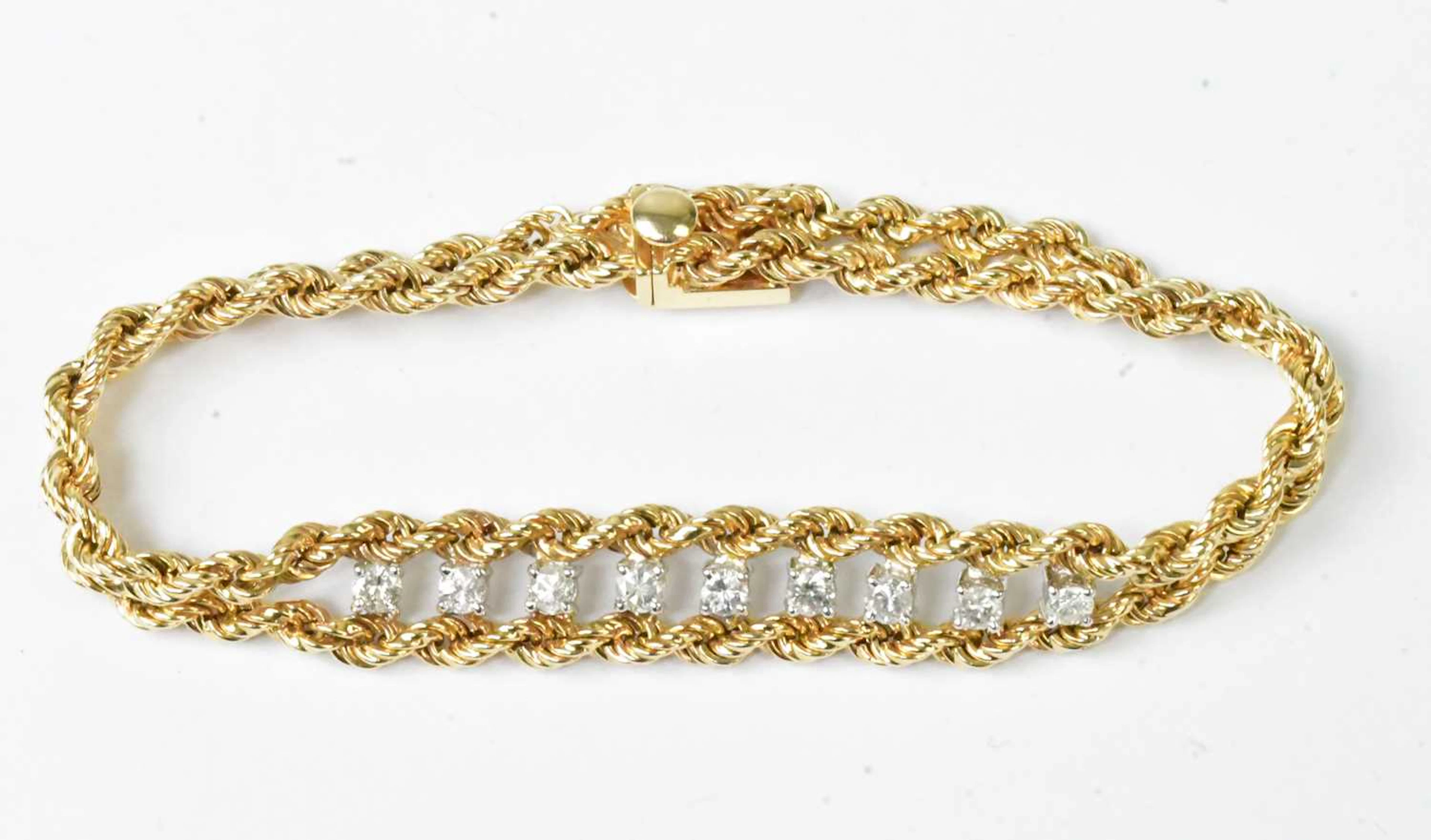 A 14ct yellow gold double rope twist bracelet set with...