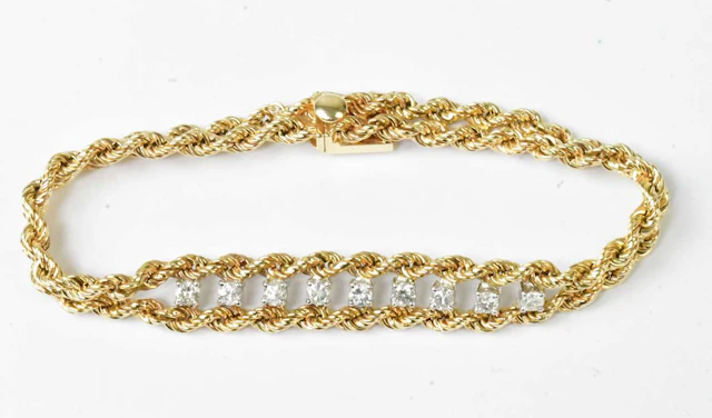A 14ct yellow gold double rope twist bracelet set with...