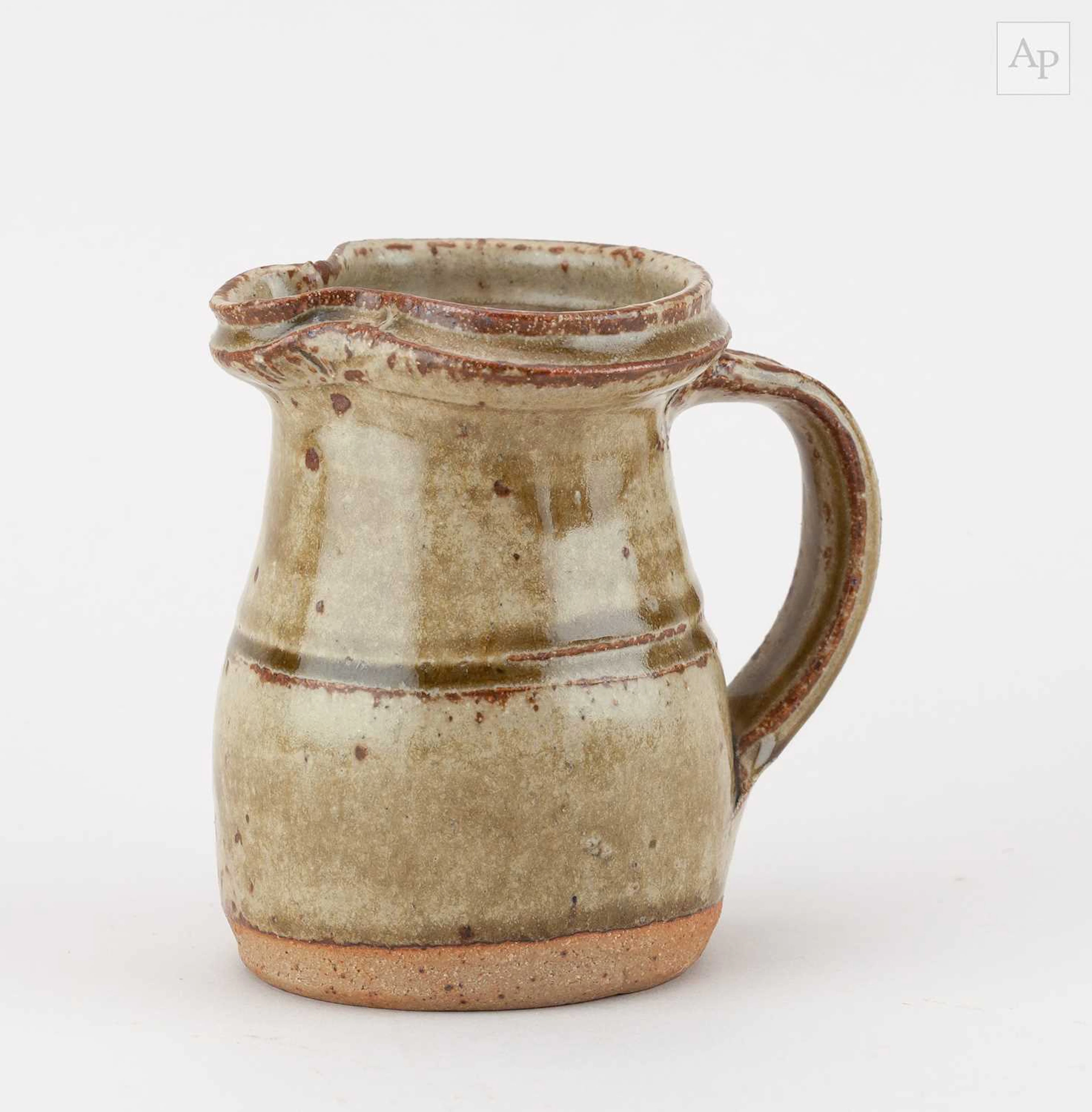 RICHARD BATTERHAM (1936-2021); a small stoneware jug covered in green ash glaze