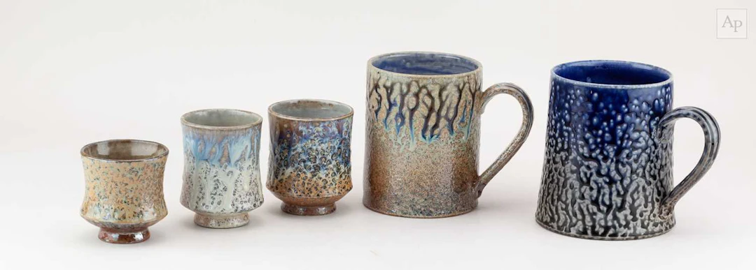 DANIEL BOYLE; a near pair of large salt glazed mugs