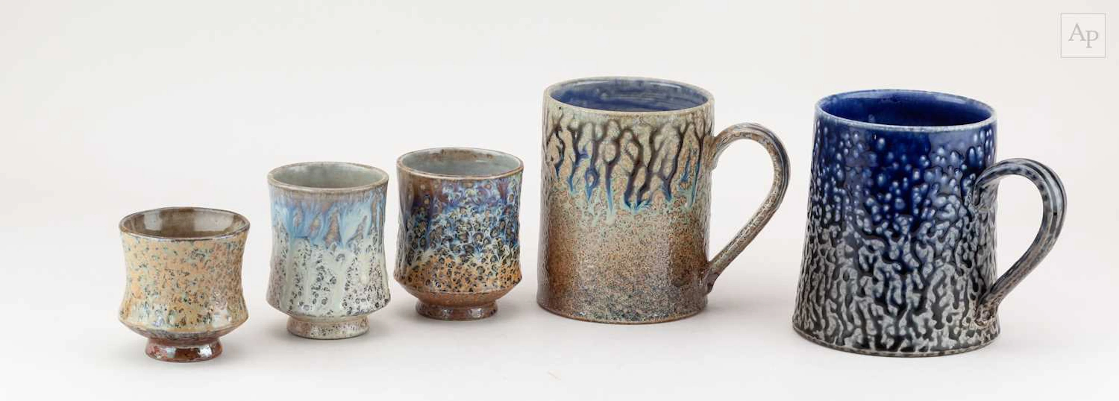 DANIEL BOYLE; a near pair of large salt glazed mugs