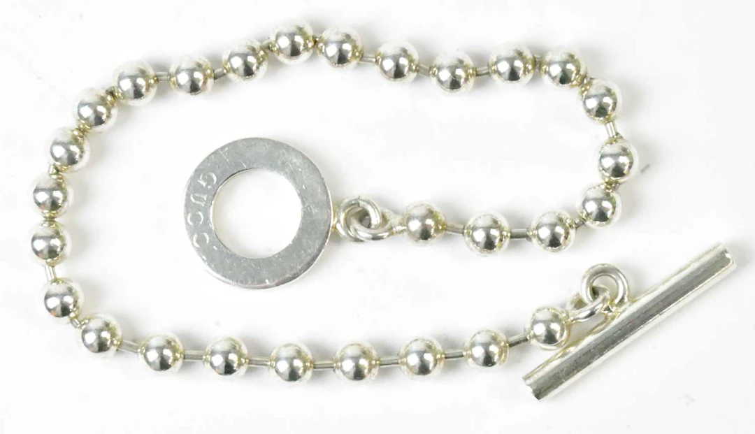GUCCI; a 925 silver 'boule' bracelet with T-bar clasp