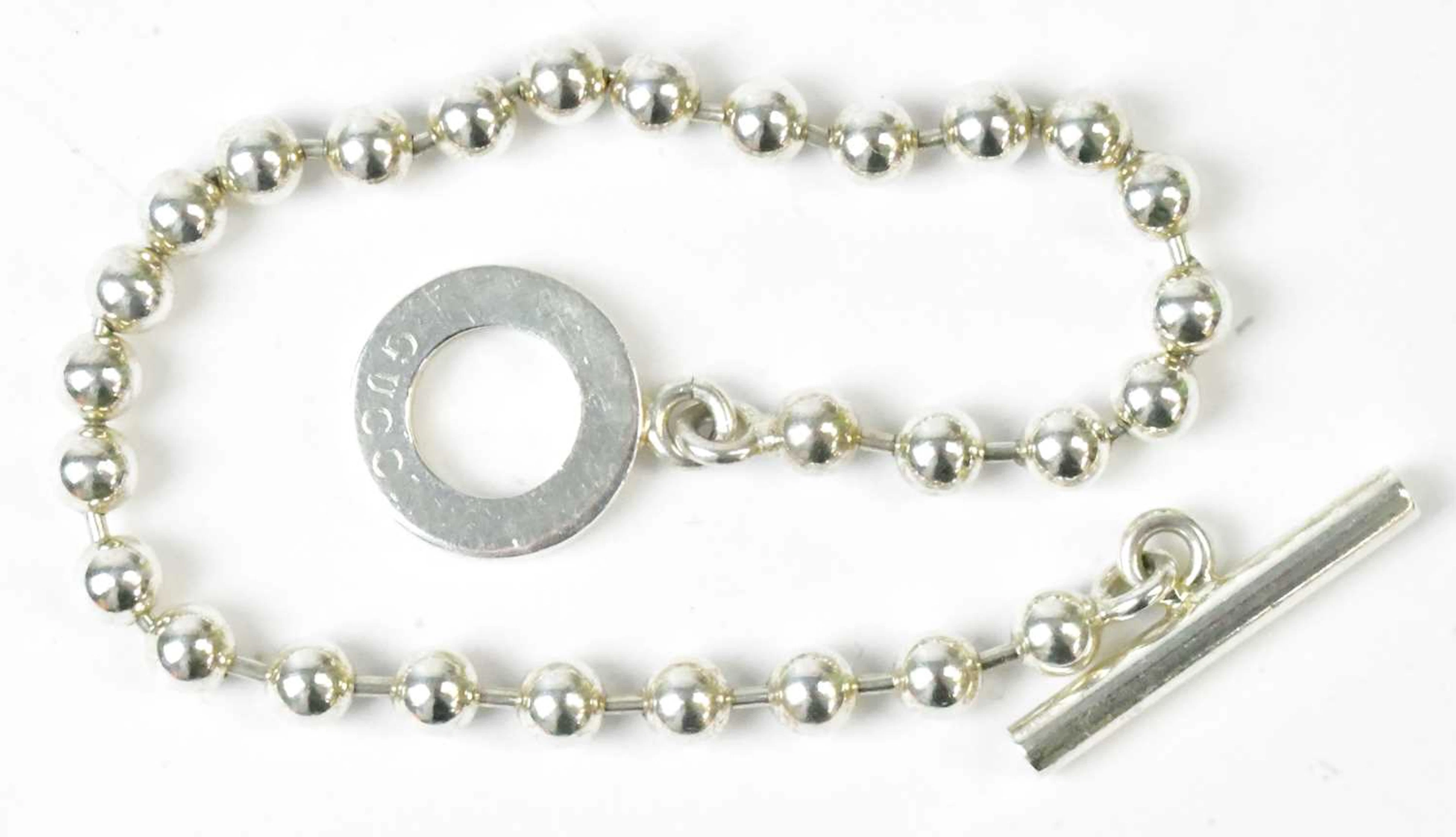 GUCCI; a 925 silver 'boule' bracelet with T-bar clasp