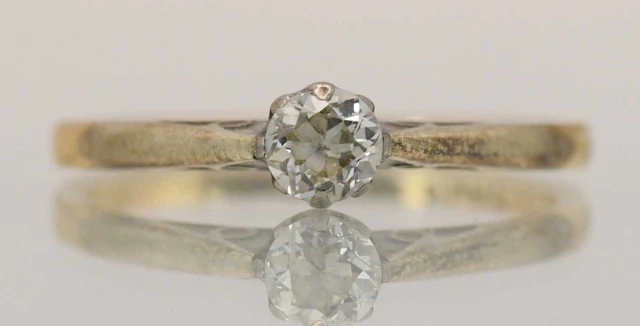 An 18ct yellow gold and platinum diamond solitaire ring