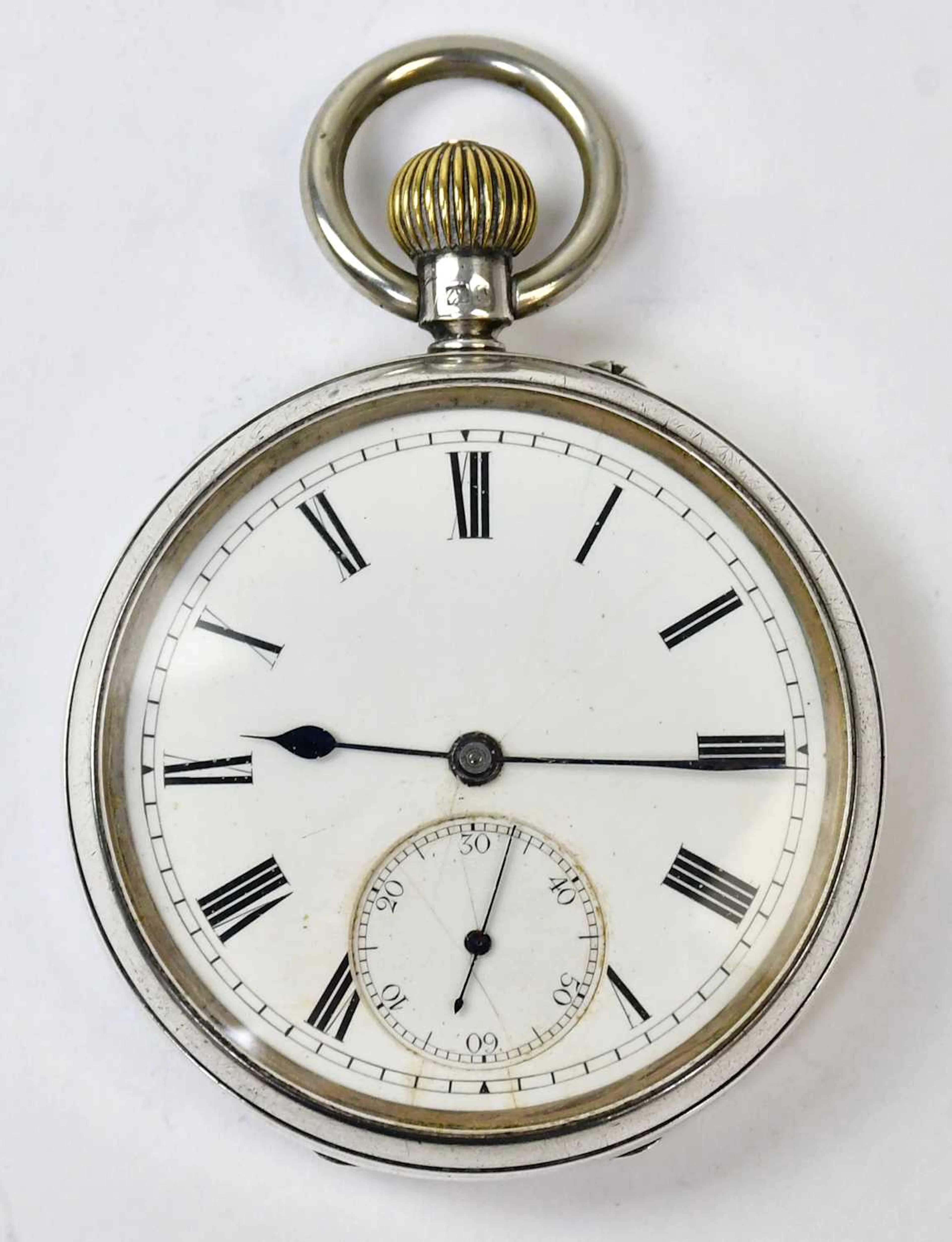 A hallmarked silver open face crown wind pocket watch