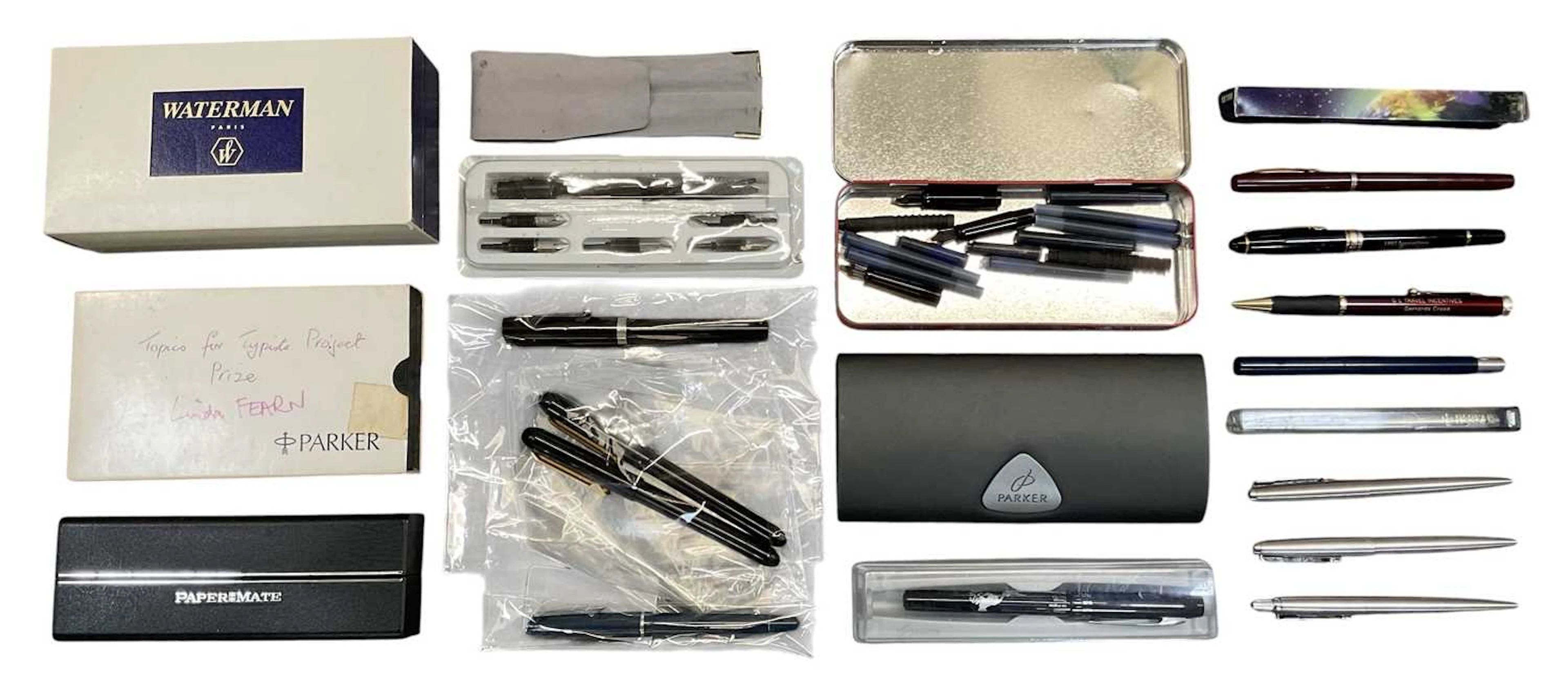 A collection of assorted pens and fountain pens