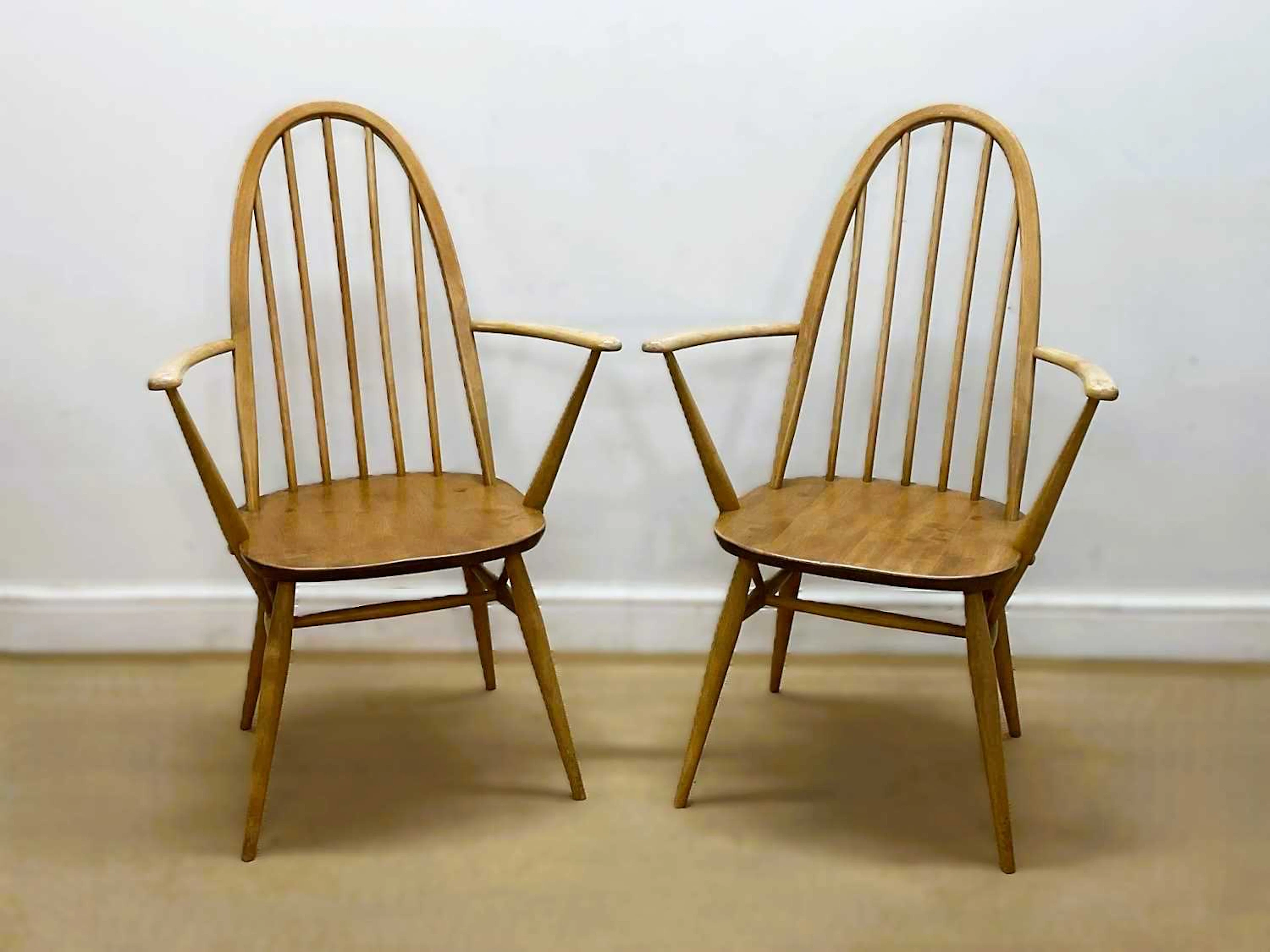 ERCOL; a pair of beech and elm 'Quaker' carver chairs