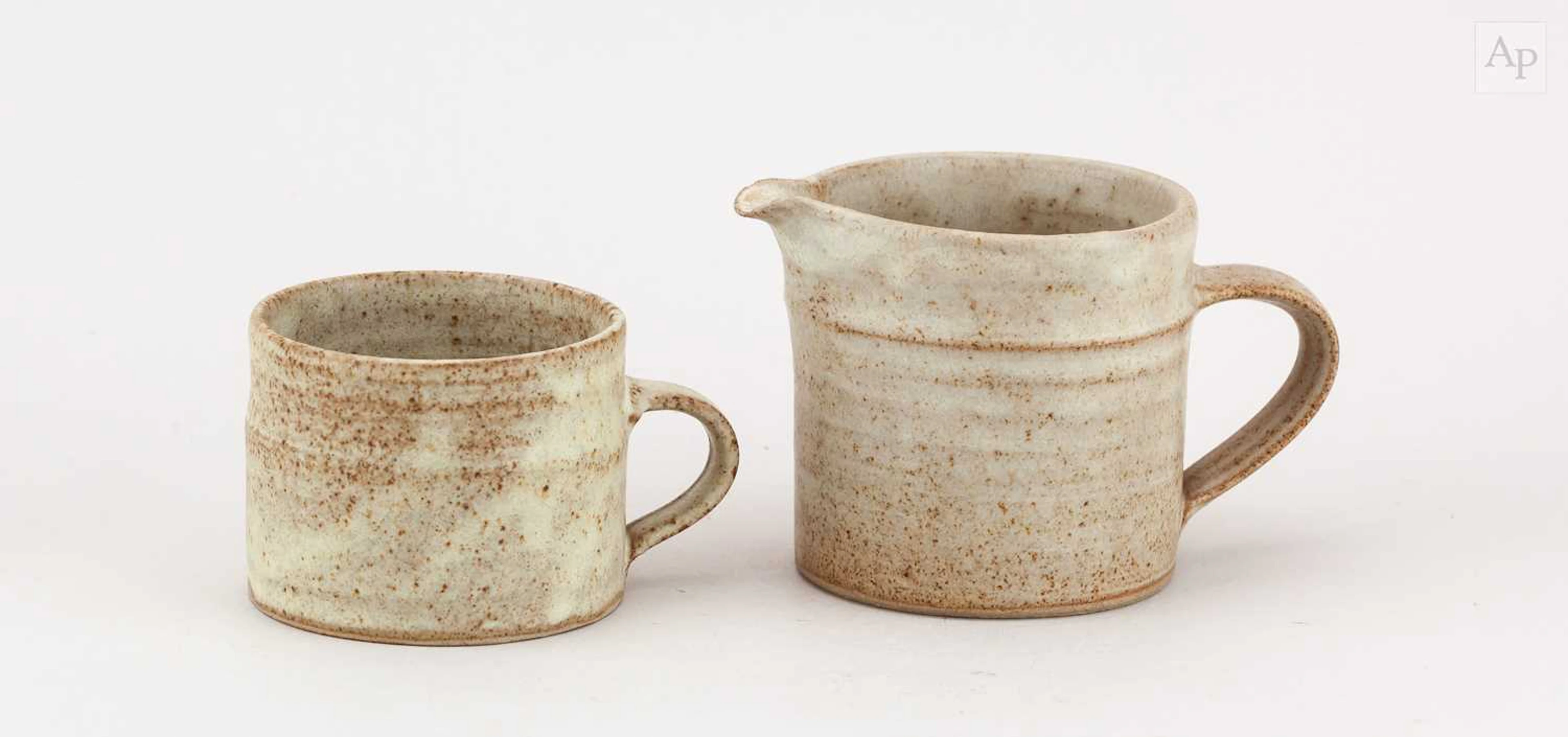 EMMANUEL COOPER (1938-2012); a small stoneware jug covered in oatmeal glaze
